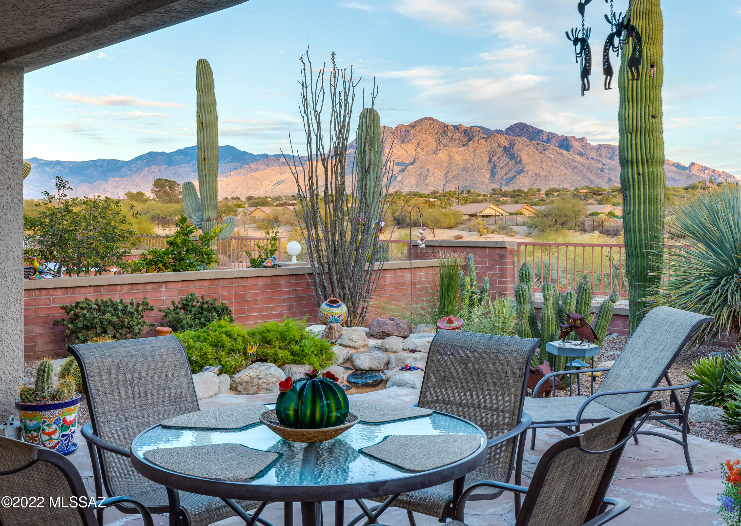 If you are looking for panoramic Catalina Mountain views, this is the home for you! 3 bedroom, 2 bath townhome in La Morada at Omni Tucson National. Original owners have updated & maintained the property beautifully.  Slab granite in kitchen, tons of pullouts offered.  All tile throughout, no carpet. Currently using 3rd bedroom as an office.  Rheem HVAC 2/24/2012, Recirc pump on H20 heater. All appliances including 2 wine refrigerators convey. Soaring Catalina Mountain views from patio as well as the great room, dining area & kitchen. 3 year roof warranty conveys. HOA covers community pool & spa, trash, front yard care, streets.  Seller prefers COE 4/1 or later.  Most furnishings available on a separate bill of sale.