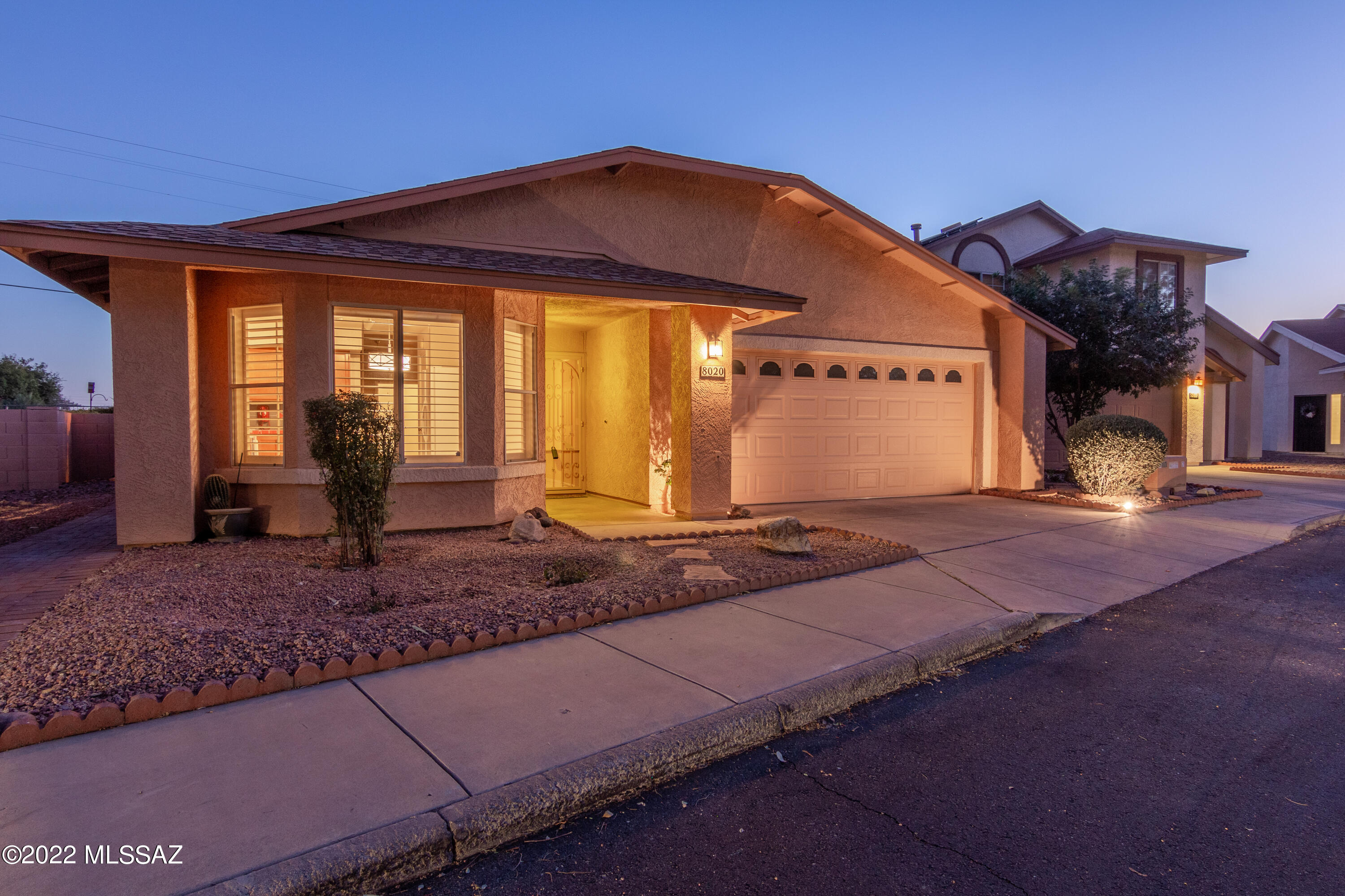 This lovely 3 bedroom/2 bath home is situated in a subdivision that is reminiscent of California with it's mature trees and green grass surrounding the crystal clear and well kept community pool.  The home itself is well maintained and professionally landscaped with pavers.  The third bedroom sits just off the great room and can be used as an office/study or craft room.  The owner's en suite bathroom has been tastefully updated and offers a walk-in closet.  Beautiful, custom wood shutters add a warm feel to the home and allow as much or as little light as you would like! The low care, fully landscaped rear yard with wrap-around patio offers enough room for gardening, pets and outdoor living. The home also backs up to the plant nursery!  No neighbors behind.