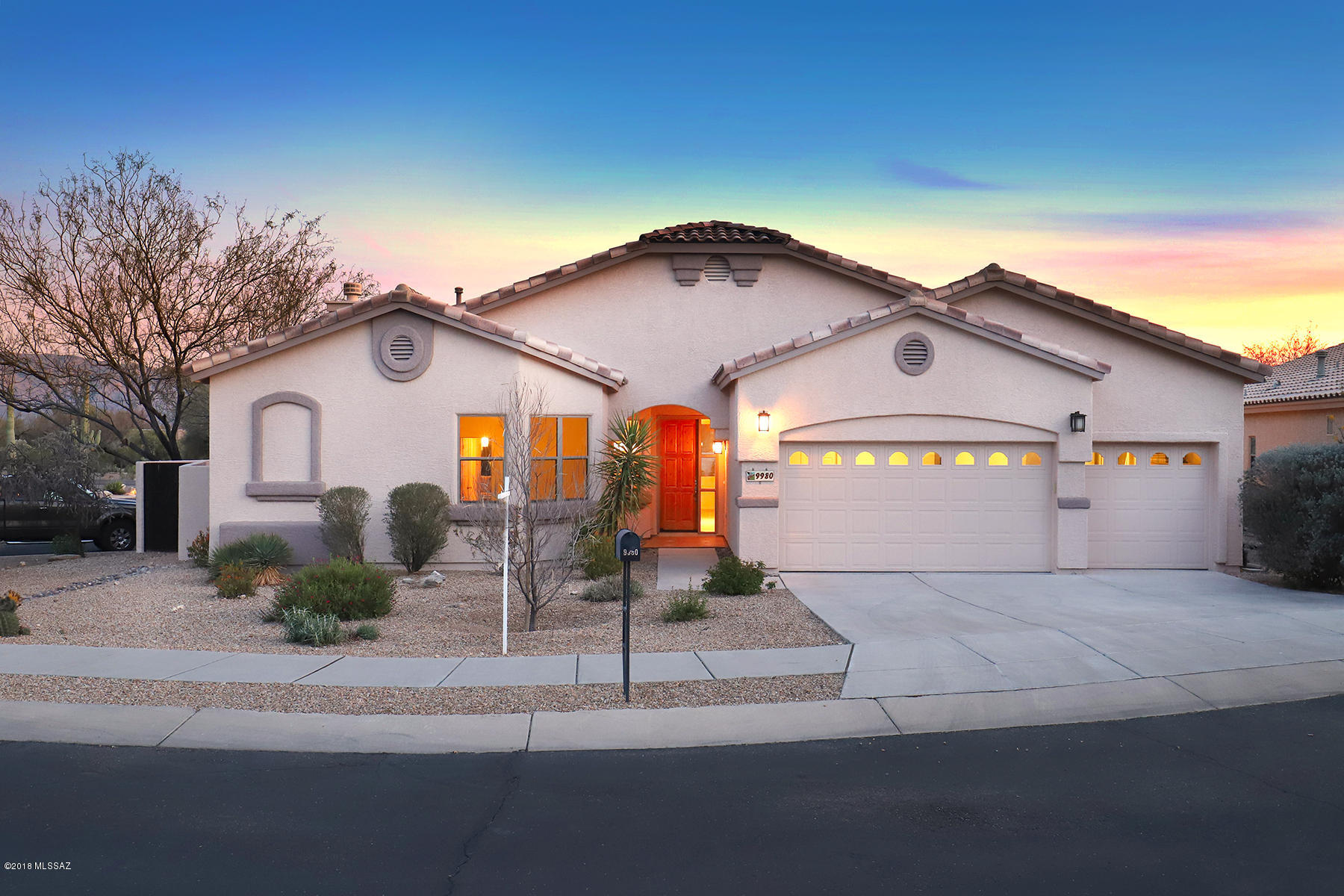 This Sabino Springs home has not just been “remodeled” and “upgraded”, it has been completely and tastefully re-created by the original owners, at a cost exceeding $117,000,  into a softly contemporary fresh “like new” impeccable abode. Located in 24-hour guarded community with mindful and attentive friendly guards who know community members, Sabino Springs is the home of Arizona National Golf Club and has many wonderful community amenities. From the street this home looks like most of the other lovely homes in the area, but step inside and POW!!! The home looks like a new model just-built home but with the advantage of being in an established neighborhood of long-term residents who love living in Sabino Springs. It's very light and bright, with large windows and glass doors providing delightful views of mountains and gardens. An open floor plan provides room for today's more casual living style, with a kitchen, breakfast nook, family room and slightly more formal but still connected living/dining area. All of these rooms enjoy vistas of gardens and the Rincon Mountains. The entire home (except newly high-end recarpeted bedrooms)  enjoys new and handsome ceramic "wood plank" flooring in a softly washed grey finish for easy maintenance and endurance. There are new cabinets throughout, with soft-close drawers and lower-cabinet pullouts, with gorgeous quartz countertops for all cabinet areas. Newly updated lighting fixtures include chandelier, pendants and wall fixtures, with brushed nickel and glass finishes. In the kitchen, an 8 foot island with handsome stone facing in grey/soft green tones, wide drawers and breakfast bar, topped with gorgeous new quartz in soft neutral tones, provides a huge workspace to gather around and help the chef. That chef will enjoy a new GE range with 4 gas burners, a griddle, double ovens and a microwave. An attractive new matte-grey GE refrigerator has cafÃ© doors with water/ice feature and freezer below. While washing dishes at the new dove grey double sink, the dishwasher will enjoy delightful views of the garden and RIncon Mountains in the distance, nothing to complain about! Double glass doors lead to the generously sized covered btile terrace and beautifully landscaped fully enclosed rear yard, with a very prolific lemon tree among other mature trees and low-maintenance plantings. Enjoy nearby birds singing a symphony as the sun rises and sets in glorious shades of pinks & oranges. (The cardinal family frequently visits, as well as mockingbirds, finches, woodpeckers, quail, sparrow and occasional falcons looking for a snack.) The family room has a newly finished stacked stone surround, mantel and hearth in soft grey-tan-green tones. There is a spacious office located off the family room, convenient but easy to close the door for work. Two guest/children's bedrooms both have walk-in closets, views and lots of natural light. The adjacent guest full bath has new quartz-topped cabinets with new sinks, faucets, lighting and a tub/shower with a smart-looking grey & white tile surround. The spacious master bedroom enjoys garden and mountain views and has a glass door out to the brick terrace. The master bath is also fully recreated, with new cabinets, soft-close drawers, new quartz counters, two separate sink areas, a new glass and tile shower, generous walk-in closet, separate W.C. with natural light, a large linen cabinet with drawers underneath, and new medicine cabinets. A large laundry room has a sink and storage cabinets. Do note the new silver-tone light switch plates in much of the home. The overall feeling of this spotless move-in ready home is one of tastefulness, freshness, modernity and livable comfort. As part of the Arizona National Golf Club, enjoy world-class golf, a beautiful clubhouse, pool and fitness center and all of the Club's activities. There are also casitas available to rent for overflow guests. Excellent schools are nearby, as is 38-acre McDonald Park offering spectacular mountain views, lighted baseball/softball fields, batting cages, basketball court, dog park, soccer/football fields, volleyball court, walking paths, and possibly the best playground area in the city. You are invited to view this delightful home today.