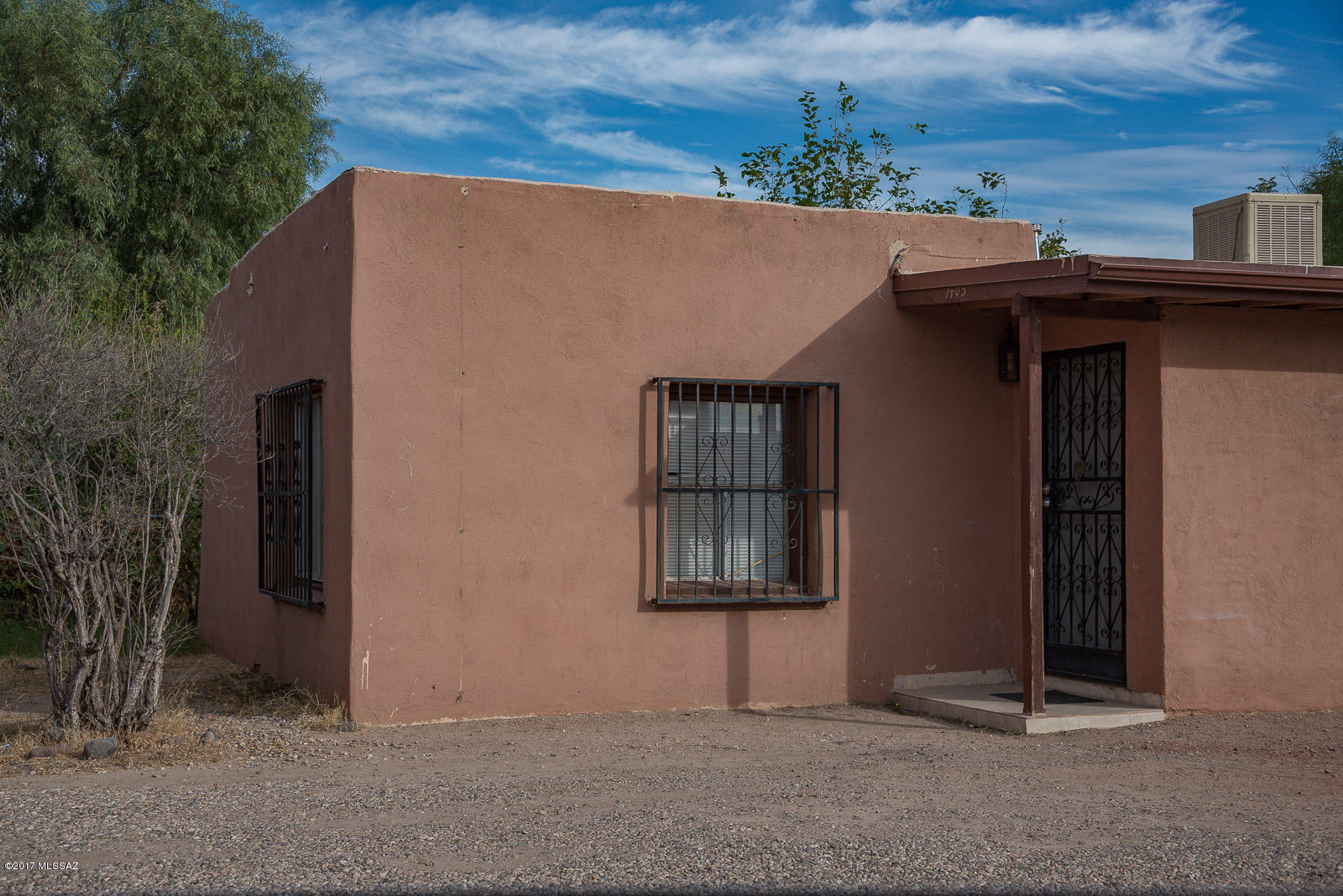 3 bedroom house built in 2010 rents for $800 per month with concrete floors, private walled yard and covered patio. Big kitchen with lots of cabinets/counters. Front 1 bedroom apartment was built in 1951, rents for $575 per month, lots of updates including ceramic tile throughout & newer kitchen and has its own private fenced yard. Separate Electric meters so tenants pay utilities. Fantastic place to live in one unit and rent the other out. Includes vacant lot next door. Could build additional or keep as extra parking.