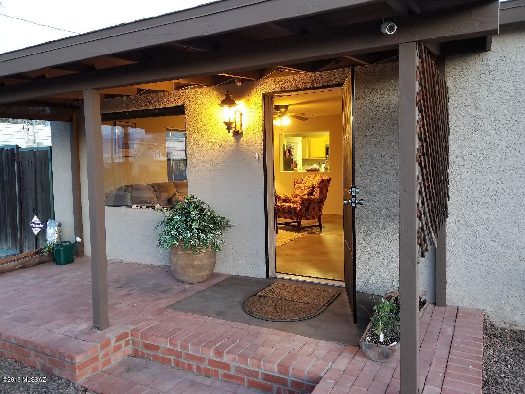 Great opportunity for this lovely 3 bedroom, 2 bath home, double gated concrete driveway to the 4 car garage with workshop and RV parking. This home is newly painted and upgraded, with new washer, dryer, refrigerator and dishwasher.  Easy to clean, beautiful concrete flooring throughout.  Great over sized back yard with beautiful sunsets and mountain views.  Centrally located.