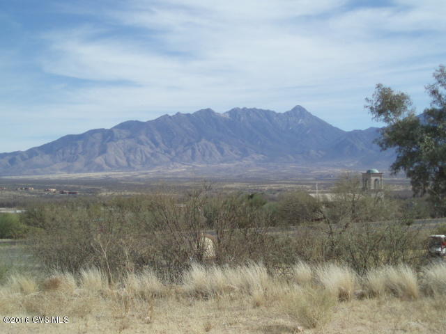 Your custom home could sit up high on this great lot with spectacular views of the Santa Rita Mountains and the Desert Hills Golf Course. Lots of value for your money with this lot. Septic system and water meter are already installed. Building pad is engineered and graded so you're ready to build. No HOA restrictions, GVR available. Contact listing agent for layout of a preliminary home design. One of the Owners is a licensed AZ Real Estate Broker.