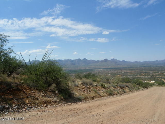 High up lot with dramatic views, great location just off the Palo Parado Bridge Rd. exit. Passed a percolation test in 2006.  Electric and water at the street.
