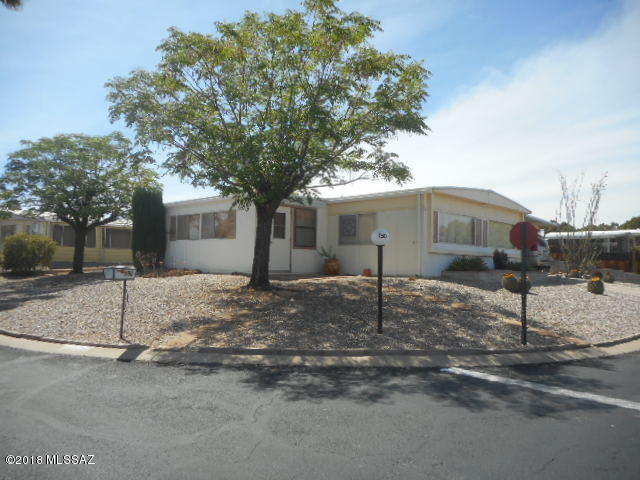 Great Location and Super Mountain Views!!! Corner lot, across from the Club House. Home is furnished, has a galley kitchen opening to dining area, living rm opens on to a well sized AZ Rm. Extra room off carport that can be used as guest bedroom, computer, office or arts & craft room. There is a separate laundry/workshop/storage rm. Easy care landscape, side patio for barbecuing and viewing sun rises and sunsets. Micro over stove does not work. Home is being offered ''AS IS'' in it's present condition. Under Termite Warranty with Bill's Home Service. HOA Fees ($55.00 monthly) includes clubhouse, spa, library, meeting rm, exercise rm, pool tables, horse shoe courts, shuffleboard, ceramics, crafts, card games, bingo, weekly trash pickup and road maintenance. This home has been a seasonal hom for the owners.