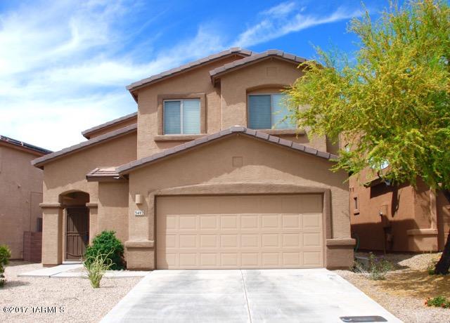 Come see this beautiful, well maintained DR Horton, 4 bedroom, 3 bath home conveniently located in Cortaro Crossings. Expansive first floor has 9' ceilings with  large great room, dining area & kitchen. Roomy kitchen is a cook's dream with beautiful maple cabinets, Silestone counters, glass tile backsplash, recessed lighting & large walk in pantry. Wonderful yard to entertain in with  a recently added “house'' length covered patio, a tiered garden area & grass lawn.  Master bedroom has a pitched ceiling.  Master bath features dual vanity w/ executive height cabinets, a walk in closet, plus additional closet space in bedroom. Three additional bedrooms upstairs plus a hall bath & laundry room.  A TEP Guaranteed home! Interior painted 2/17. Close to shopping, schools, YMCA, library & parks.