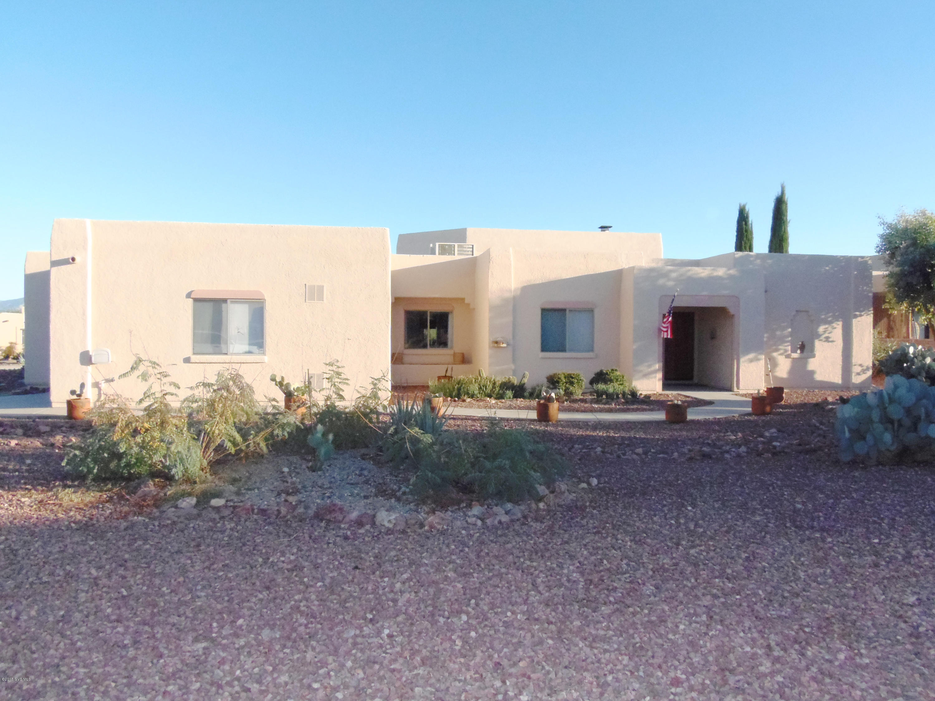 One of the largest lots in Portillo Ridge! Well cared for two bedroom two full bath Santa Fe style. Open concept kitchen w/plenty of cabinets and closet pantry. Great room w/soaring ceilings, display ledge and kiva fireplace. Large master suite w/slider to covered patio. Master bath w/ walk-in glass block & tile surround shower, garden tub and dual vanity. Den off great room. Office off kitchen. Garage has additional craft room/workshop and golf cart storage.