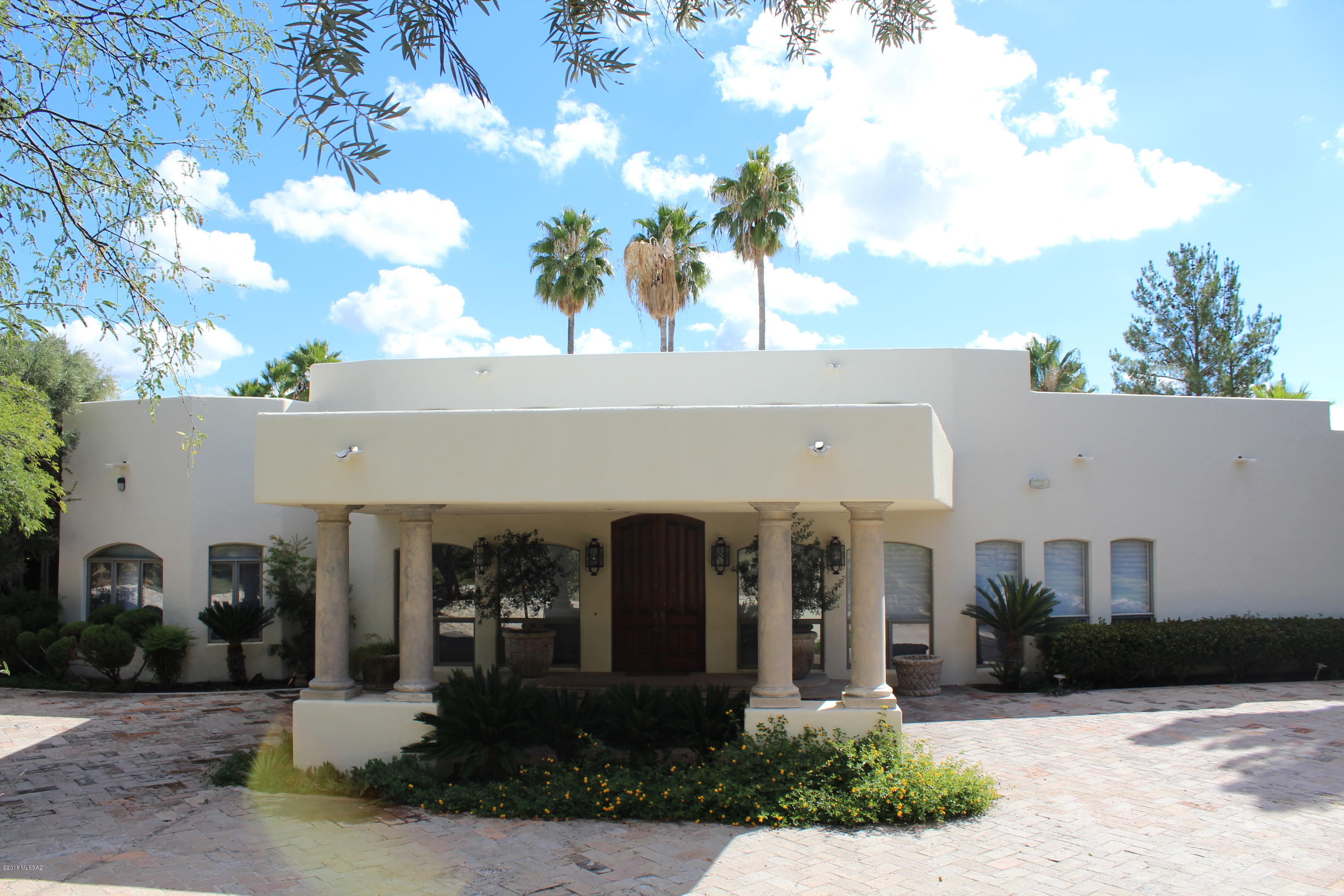Magnificent Estate in the foothills of Nogales, Arizona.  Old world charm emanates from this 4 bedroom, 5 bath home in the Vista Del Cielo Subdivision. With over 8,000 square feet of space this home and entertainment building/guest casita is also perfect for entertaining. There are numerous sculptured rock patios and manicured lawns with a gorgeous pool and many outside patios and fountains.  This lovely estate is situated on over 4 acres of land so you have plenty of privacy but are only minutes from the amenities of the City of Nogales.  The Mediterranean architecture and elevated portico entrance combined with wood and flagstone floors provide a grand feel to his lush oasis in the foothills.  Please schedule a showing or preview so you can feel the grandeur of this home.