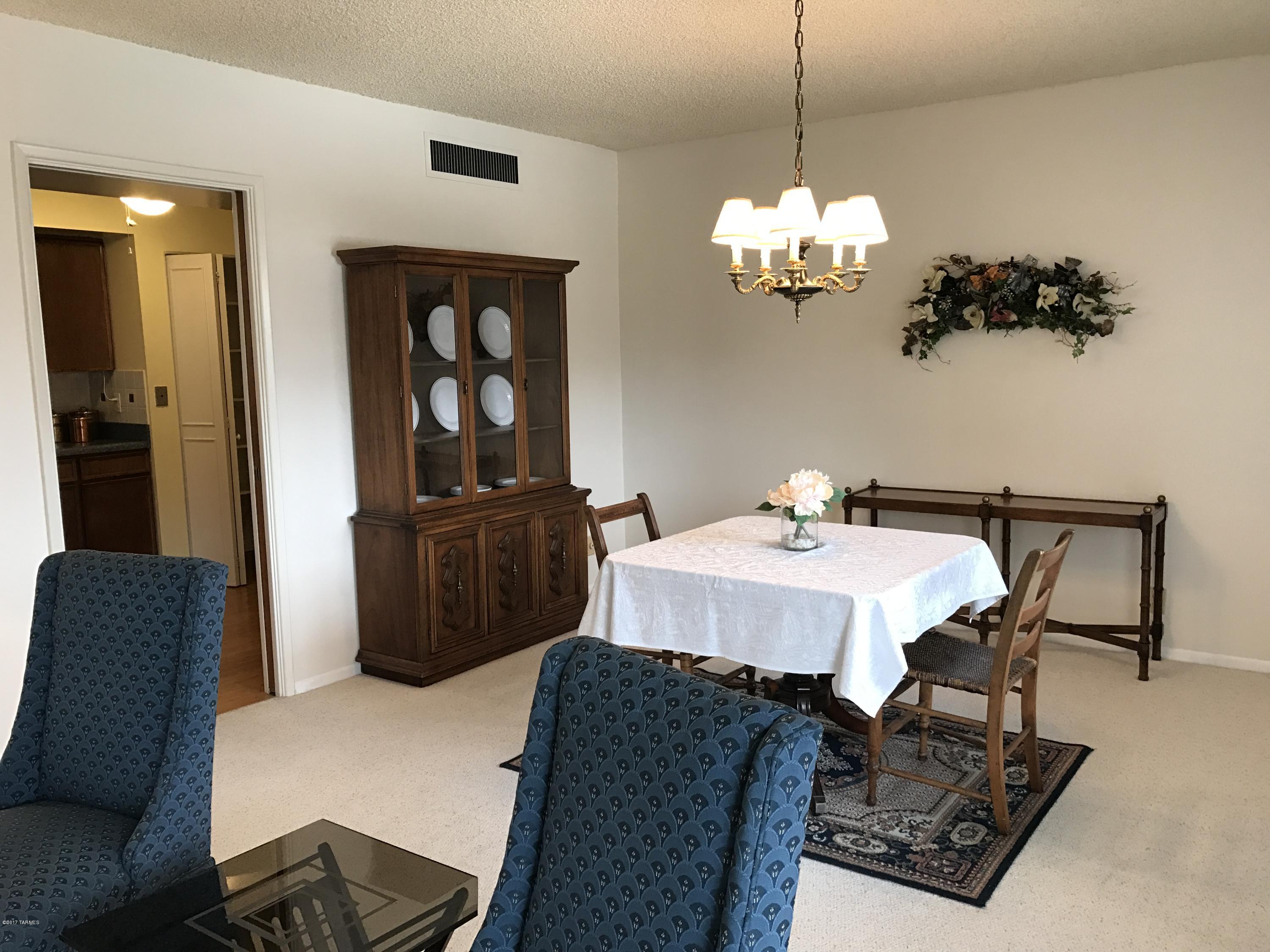 Absolutely impeccable! 1542sf 2bd/2ba . SPACIOUS liv/dining area with add'l space to be used as a den, office - even extra space for guests! This unit with it's long balcony faces north - over looking the renovated spa/pool. Eat-in kit w/newer appliances, wainscoting and huge pantry. Solid wood cabs & oodles of storage! Space for breakfast table/chairs. New, gleaming bamboo floors in entry, hall and kitchen. Mst bdrm has sliding doors w/plantation shutters opening to balcony.  Spacious mst bath w/2 double closets PLUS linen closet. Newer tile floors in both baths. Tub/toilet area separate from vanity. 2nd bdrm w double Murphy bed-storage on each side! Double closet. Second bath with shower. Ceiling fans in bdrms, kit and mst bath! Entry w/coat closet & custom dry bar. Shared, enc garage.
