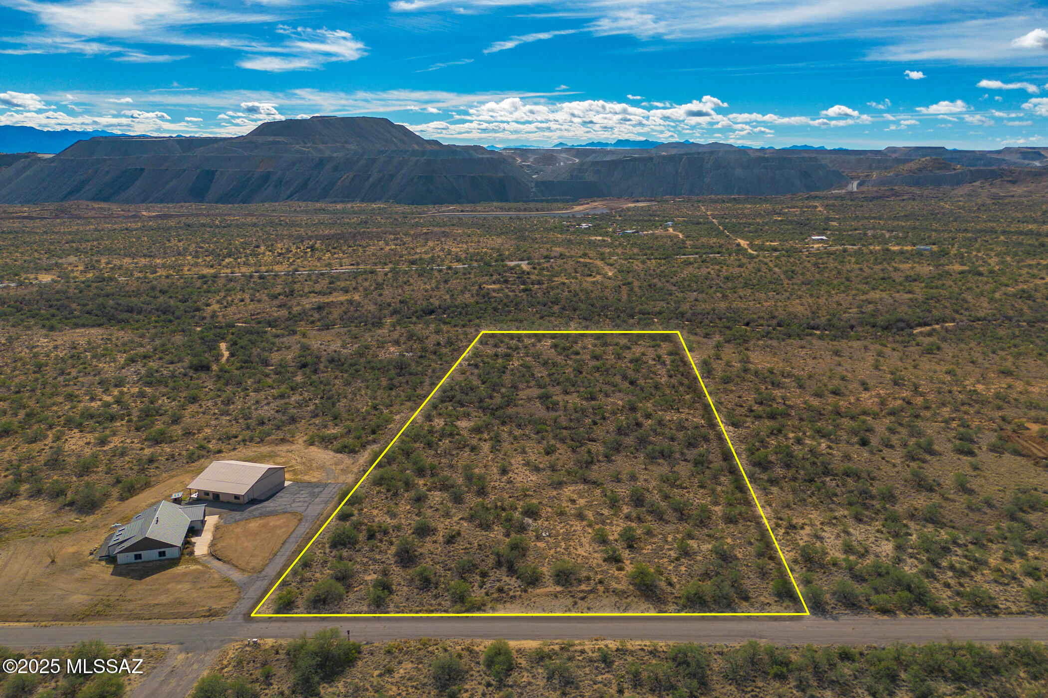 This homesite sits within Ruby Star Airpark, a unique aviation and equestrian community anchored by a 4,300-foot paved runway, making it ideal for anyone seeking space, privacy, and versatility. The lot includes its own private well and offers easy access to the community's paved roads, which also serve as aircraft taxiways. The property is flat, spacious, and perfectly suited for a custom home with room for a hangar, equestrian facilities, or both. County roads leading from I-19 to the community have been newly repaved, ensuring smooth and convenient access.