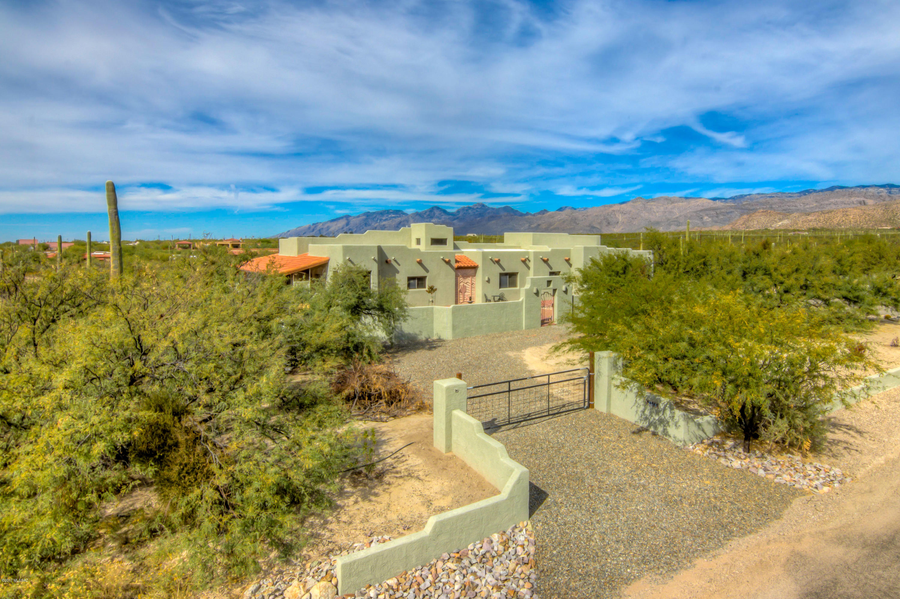 Beautiful, bright open floor plan with wrap around patio and views for days!!
Enjoy amazing mountain and sunset views from this exquisite masonry stucco home at the base of the Rincon Mountains! RV garage,ceramic tile, newer ss appliances, upgraded flooring, huge craft room/laundry room, gorgeous beam ceilings,fully redesigned and spacious courtyard, and so much more! Must see to appreciate this truly unique custom desert property!