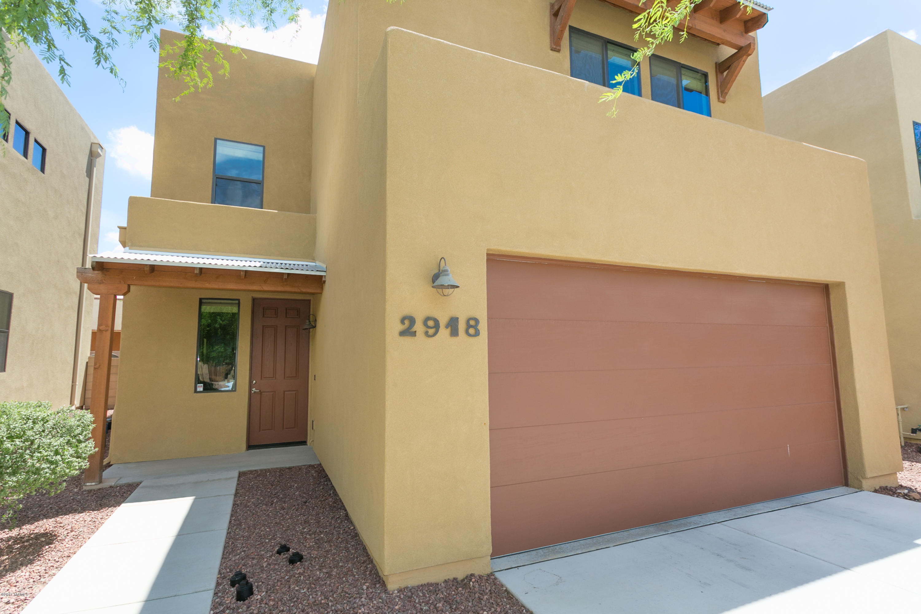 Beautiful home built in just 2012! If you are looking for like new in Central Tucson, this is it! This immaculate, well cared for 4 bedroom 2.5 bath home is nestled inside a rare gated community near the University of Arizona, Shopping, and many other central locations. Spacious lower level living space with ceramic tile create an open great room concept. Kitchen equipped with gorgeous Dark Wood Cabinets, Walk in Pantry, Granite counter tops, SS Appliances with Gas Range. Dual pane windows, plenty of natural light. Front and Rear yard with low care landscaping. House and Garage freshly painted. Washer and Dryer stay! The basics are all done for you. This clean slate is ready for all your personal touches to complete! Welcome Home