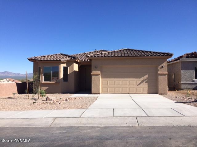 We have finished this spec home with beautiful granite kitchen tops, brushed nickel faucets and accessories, a fully tiled walk-in master shower and a ton of tile floors including a tile rug entry. This home also includes a 3-car tandem garage, bay windows in the master and guest bedroom, upgraded stainless steel appliances, soft water loop, gas stub-out for future BBQ, utility sink in garage and a structured wire pane. You just have to see all you get for the price. Did we mention the views?