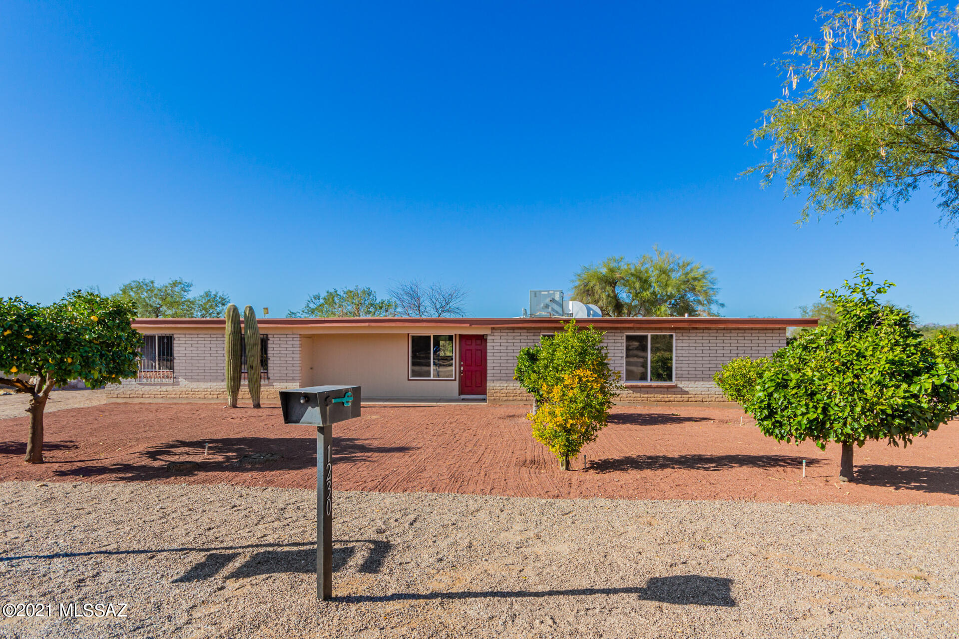 Spectacular remodeled home with spacious floor plan of 1,866 SF with 4 bedrooms, 2 bathrooms in the heart of the northwest side. Enjoy your own orchard of a variety of mature fruit trees in the front of your dream home. This gourmet kitchen is equipped with SS appliances, abundance of modern cabinets, granite countertops, and island breakfast bar. Relax under the covered patio that overlooks the beautiful Catalina Mountains. The backyard has plenty of space to make it your own backyard paradise. Owner is a licensed agent.