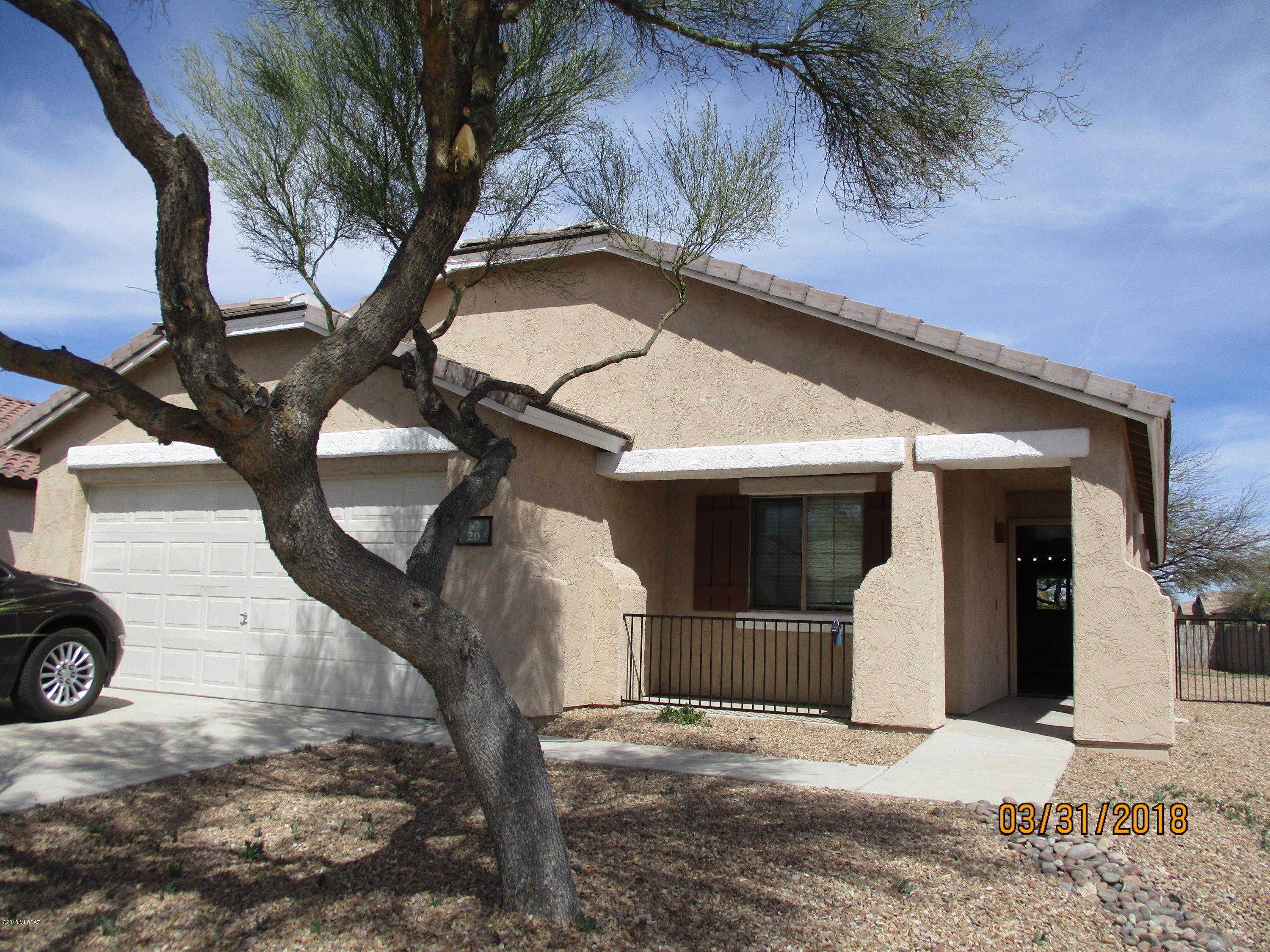 Don't miss this stunning former model! Beautiful ceramic wood look tile throughout. Ceiling Fans in every room. Upgraded granite counters and newer stainless steel kitchen appliances make this home the perfect place! Beautiful brushed nickel accents.