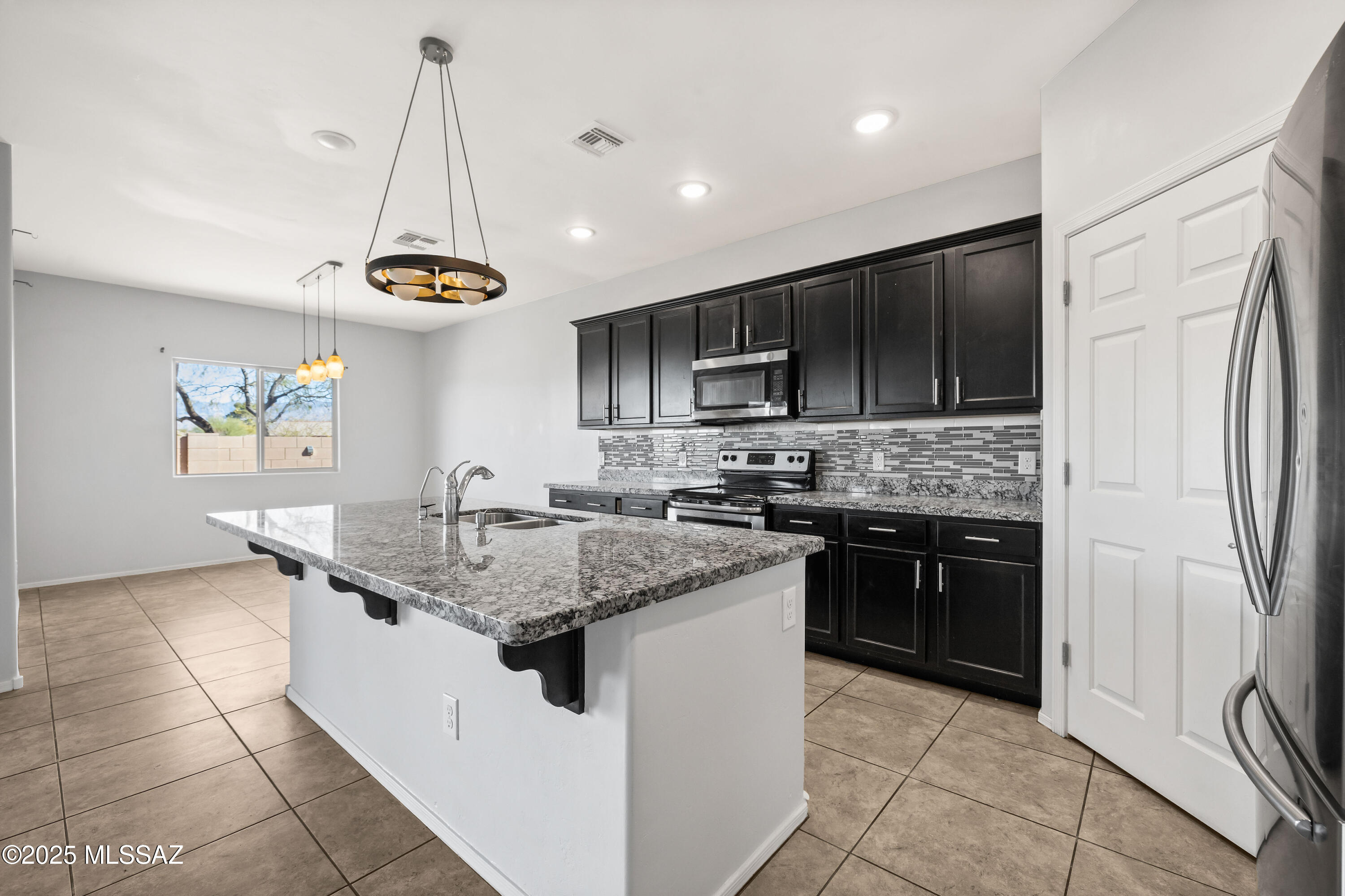 Seller Reviewing offers Between $354,000- $374,000. A Must See!! This beautiful home built in 2017 offers you large bedrooms and entertainment areas. Enjoy the majestic mountain views from your kitchen and living room. A large greeting area at the entrance with a coat closet for you and your guest. As you walk towards the living room you will find a large den that can be transformed into your library or relaxing area. Open concept kitchen with a huge island. Next to the kitchen is the perfect dining area with a view to the back yard that has been landscaped with pavers. Upstairs you will find a large loft for a cozy family area away from the common spaces, large master bedroom with a spacious walkthrough closet.  Perfect home for your family or even as an investment property. close to various shopping centers and entertainment.