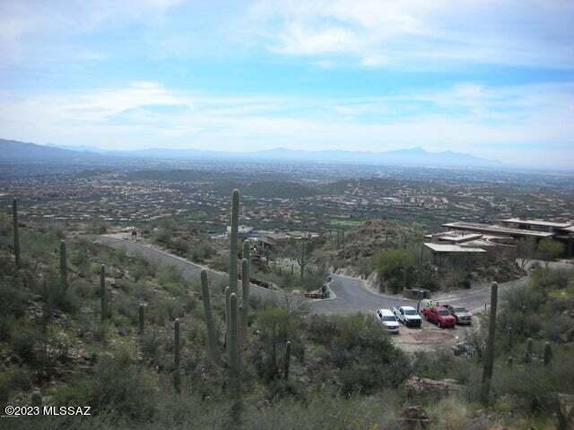 LARGEST, HIGHEST, MOST PRIVATE and MAGNIFICENT remaining parcel in Tucson's world renowned resort community, VENTANA CANYON COUNTRY CLUB. LIve on 28 acres at the base of the Santa Catalina Mountains surrounded by MOUNTAIN RIDGES AND CANYONS, TOWERING SAGUAROS and BOLD ROCK OUTCROPPINGS. Enjoy breathtaking, SUNRISE to SUNSET VIEWS of the golf course below. DISTANT MTN. RANGES and watch the ENTIRE TUCSON BASIN glow in it's EVENING LIGHTS. Or purchase ''DESERT WATER FLOWING'', the 6900-7540 SQFT, $4.9-$5.5 Million home Kevin Howard, renowned Tucson Architect/Builder,  designed for this site. Featured and listed separately in MLS #22307146, Either land or home, experience MOUNTAIN LIVING in TUCSON at it's VERY FINEST.