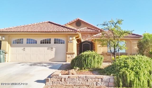 Absolutely GORGEOUS 3bd 2ba 1511sf home loaded with upgrades! Formal model home features beautiful custom tile flooring in all the right
places, functional breakfast bar kitchen with solid surface countertops and tons of walnut colored cabinets for plenty of storage. HUGE master bedroom suite, walk in
closet PLUS two more closets. Extra large expanded back patio to enjoy our AMAZING year round Arizona weather. Lovely front and back yard landscaping and much
much more!