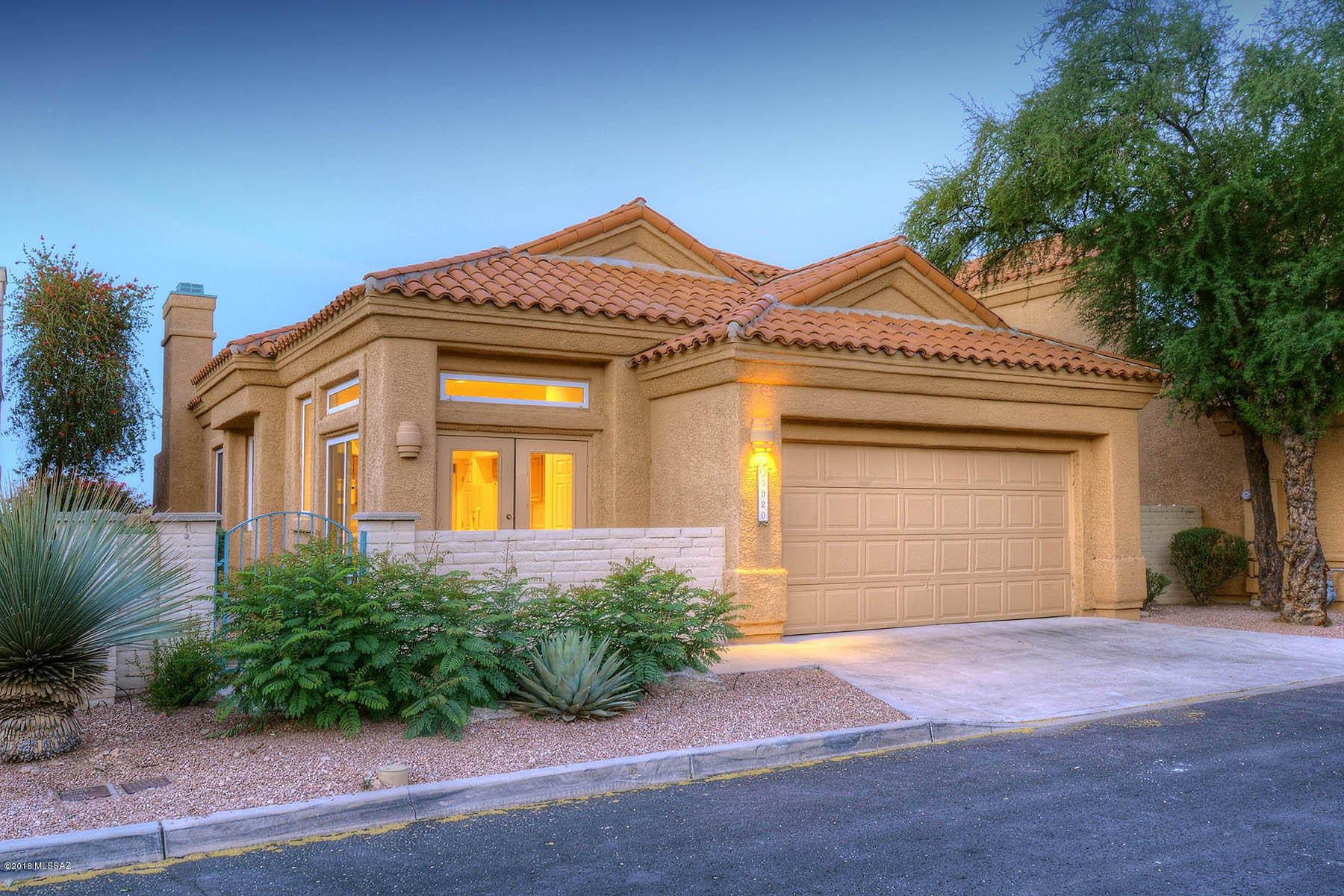 Lovely patio home on gorgeous view lot on the golf course. CFSD award winning school district. Gated La Paloma residential community. Beautiful sunset,mountain,city and golf course views! Master bedroom downstairs - also eat in kitchen, great room, laundry, 1/2 bath. 2BR and 1BA upstairs. Brand new water heater, flooring, toilets,sinks.  Inviting bricked patio. Mature landscaping.