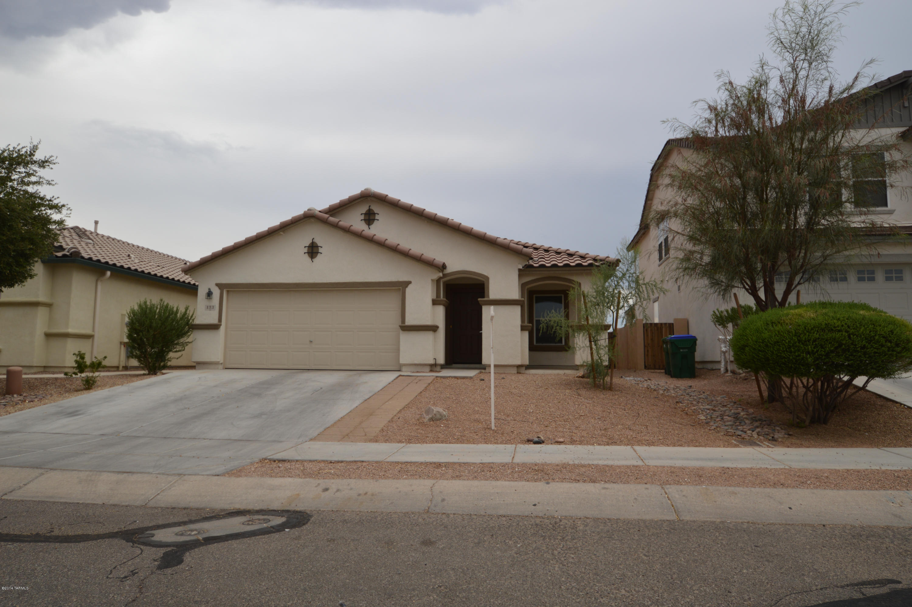 Fabulous 3BR in beautiful Sahuarita!  Great home in a great location with great community features including pool, Rec Center and sports courts!! Three large bedrooms and huge common areas! Well-equipped kitchen with breakfast bar and plenty of space! Gorgeous laminate! Walled backyard with new gravel perfect for kids or approved pet and such a breeze to maintain! This wonderful home has so much to offer, and all of it could be yours! You're not going to want to miss this one! SO CALL TODAY!