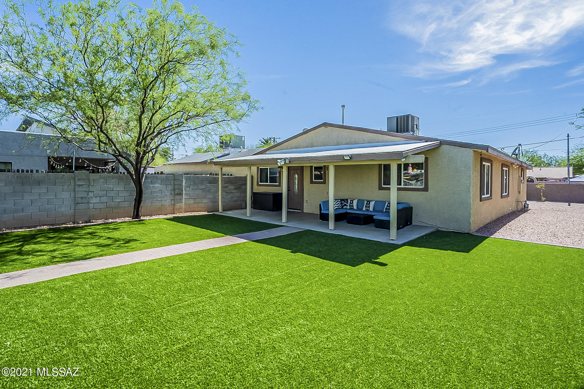 This updated dual owner's suite home sits on a large quarter acre lot, fully fenced with solid block wall and gate access. Completely renovated in 2013 including all new plumbing, electrical, 2 HVAC units, and new roof. Entertain in this open concept home with an upgraded kitchen, featuring granite countertops, undermount sink and brushed nickel hardware. Enjoy the large private yard with covered patio and luxurious turf landscaping, perfect for backyard parties. Convenient central location, close to Trader Joes, RoadHouse Cinemas, and TMC.