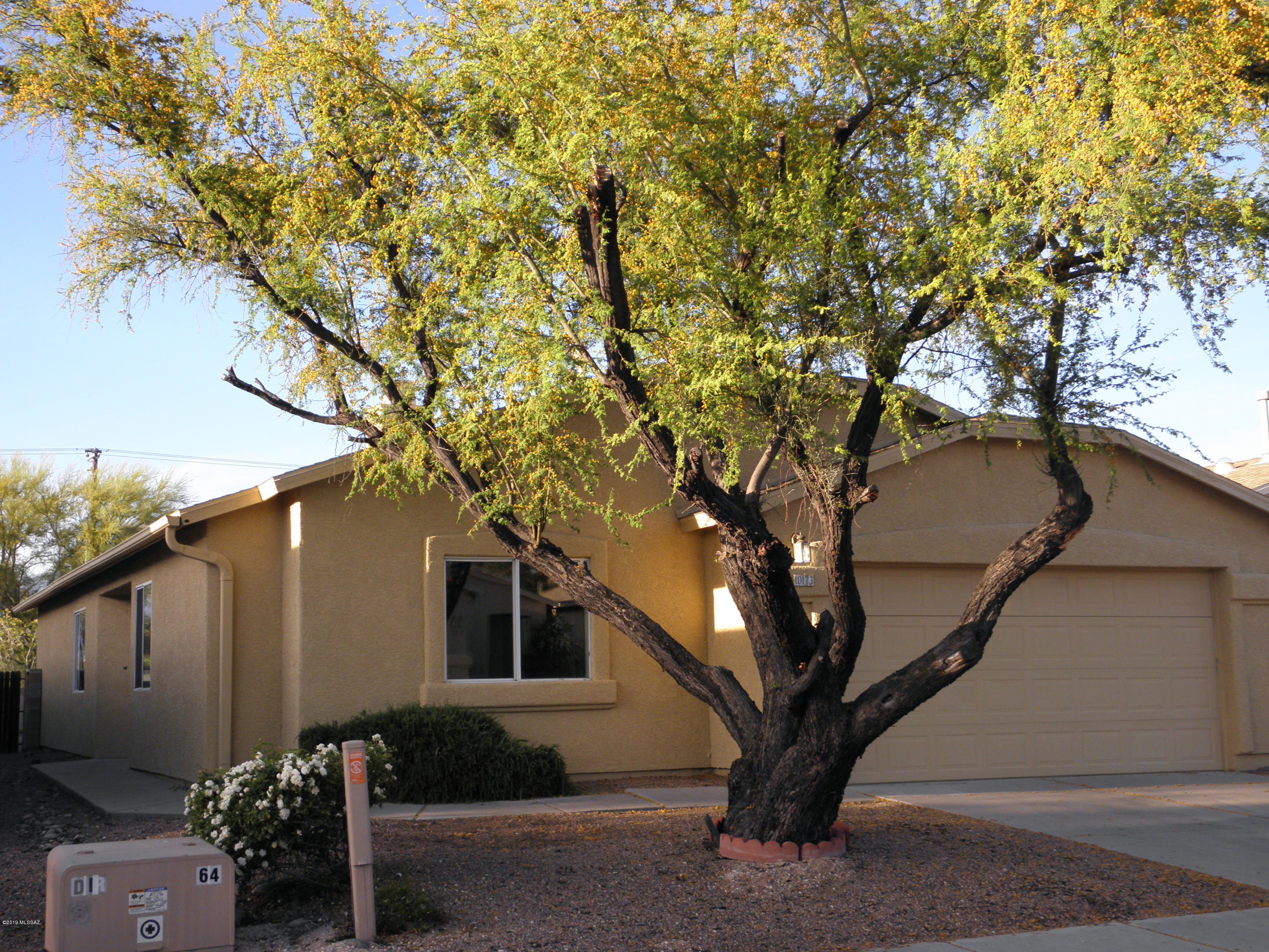 Seller will accept or counter all offers between $215,000 and $220,000. Striking panoramic Catalina mountain views with a North/South exposure you can enjoy while sitting on the huge covered patio. Backyard landscaped with beautiful brickwork and easy maintenance. This well cared for home has brand new LG refrigerator, replaced windows and new slider and free and clear solar hot water system for long term savings. A large office that could be made into a fourth bedroom plus a large separate master suite. Separate washer dryer room leads to a large two car garage. Great room concept with high ceilings is light and bright. The location is ideal. Saguaro National Park East five minutes away, an hour to the top of Mt Lemmon and restaurants and shopping very close by. Make sure you see this one