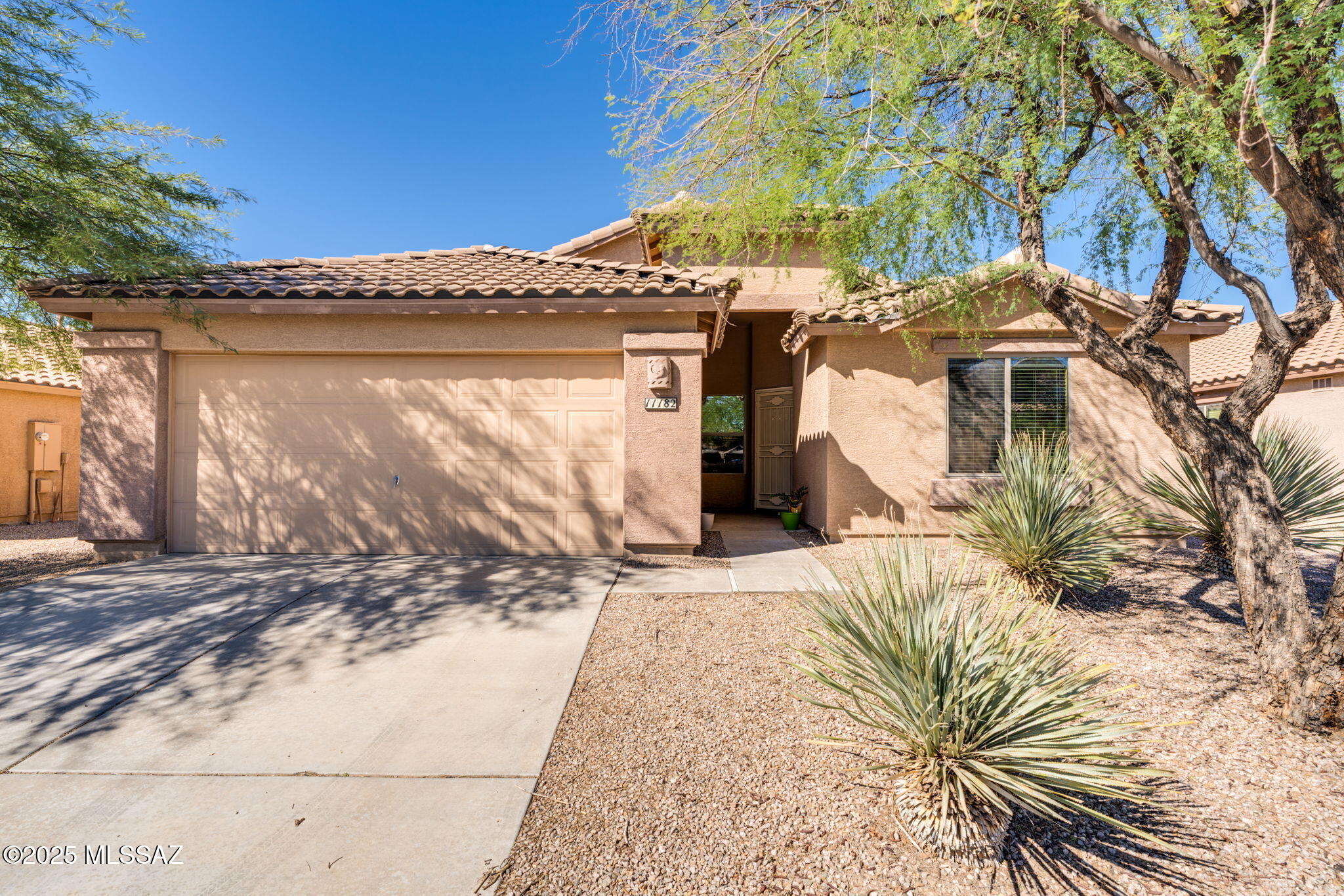 Fantastic 4B/2Bath open floor plan home w/ lots of natural light & outdoor living space! 2020 A.C. unit, lots of kitchen cabinet space and upgraded flooring throughout the main living areas. Plenty of storage space in the oversized garage. Enjoy morning and evenings on the back covered patio and the large yard large to add a garden or pool. Community amenities include parks, playgrounds, ramadas, BBQ's, basketball & volleyball court, baseball/soccer field. Close to I/10  and nearby shopping & restaurants and so much more.......Make this Marana home yours today!