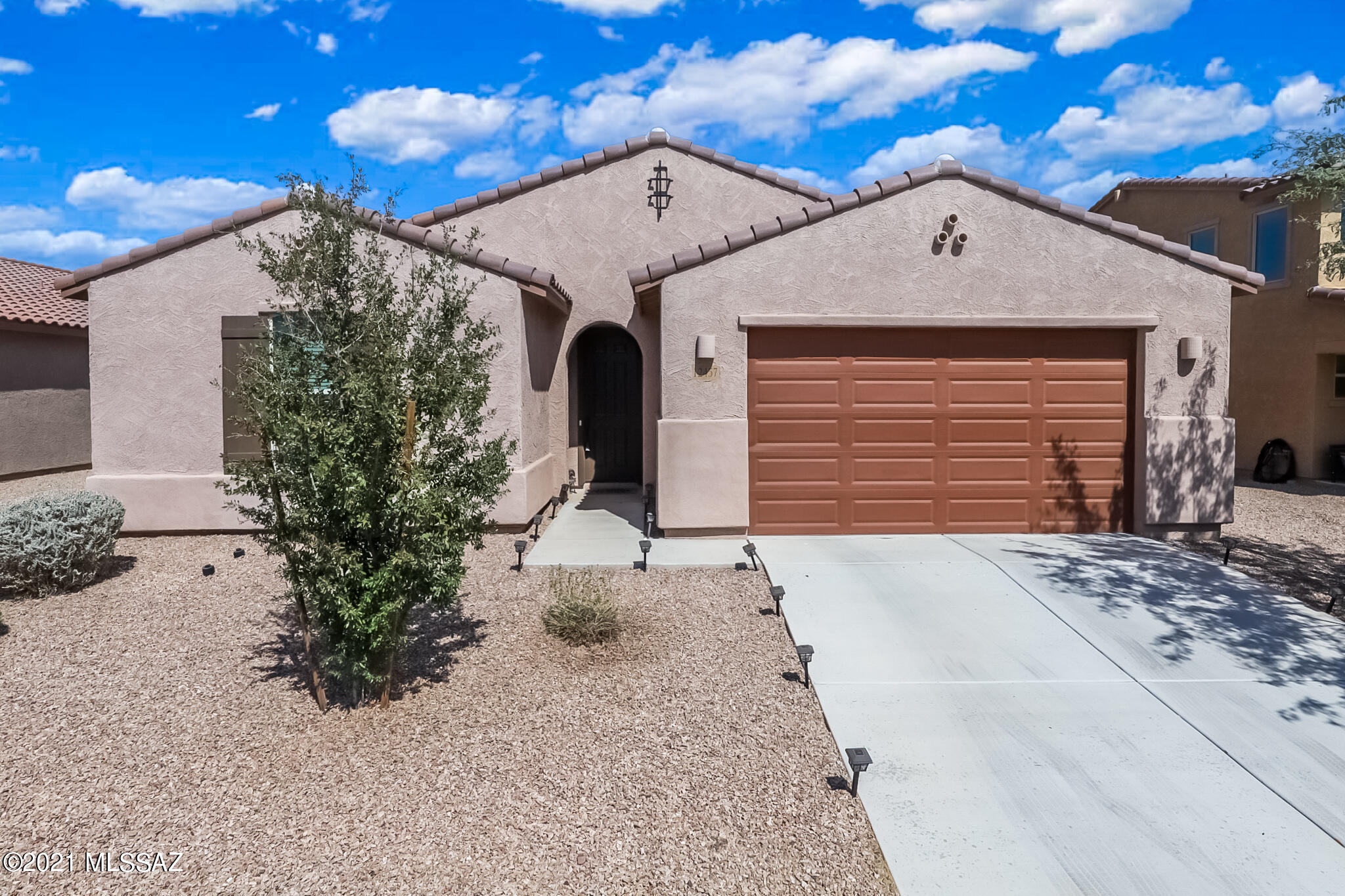 This stunning, energy efficient home is ready for it's new owner(s). This like new, 2017 Meritage home features desirable open concept with a split bedroom floor plan. Upgraded kitchen includes large island, expresso cabinets w/ crown molding, gas cooktop and walk-in pantry. Flex space can be used as formal dining room, den, hobby room, or whatever you desire.  Master ensuite has His/Her  closets and vanities. Large garden tub is great for an evening soak to relax and unwind. Upgraded carpet in all bedrooms. Enjoy entertaining guests in your low-care backyard w/ covered patio, extended pavers, and fruit trees all on irrigation system. The 3 car tandem garage is perfect for additional storage, toys, workout space, etc.. Enjoy all that the Gladden Farms community has to offer!!