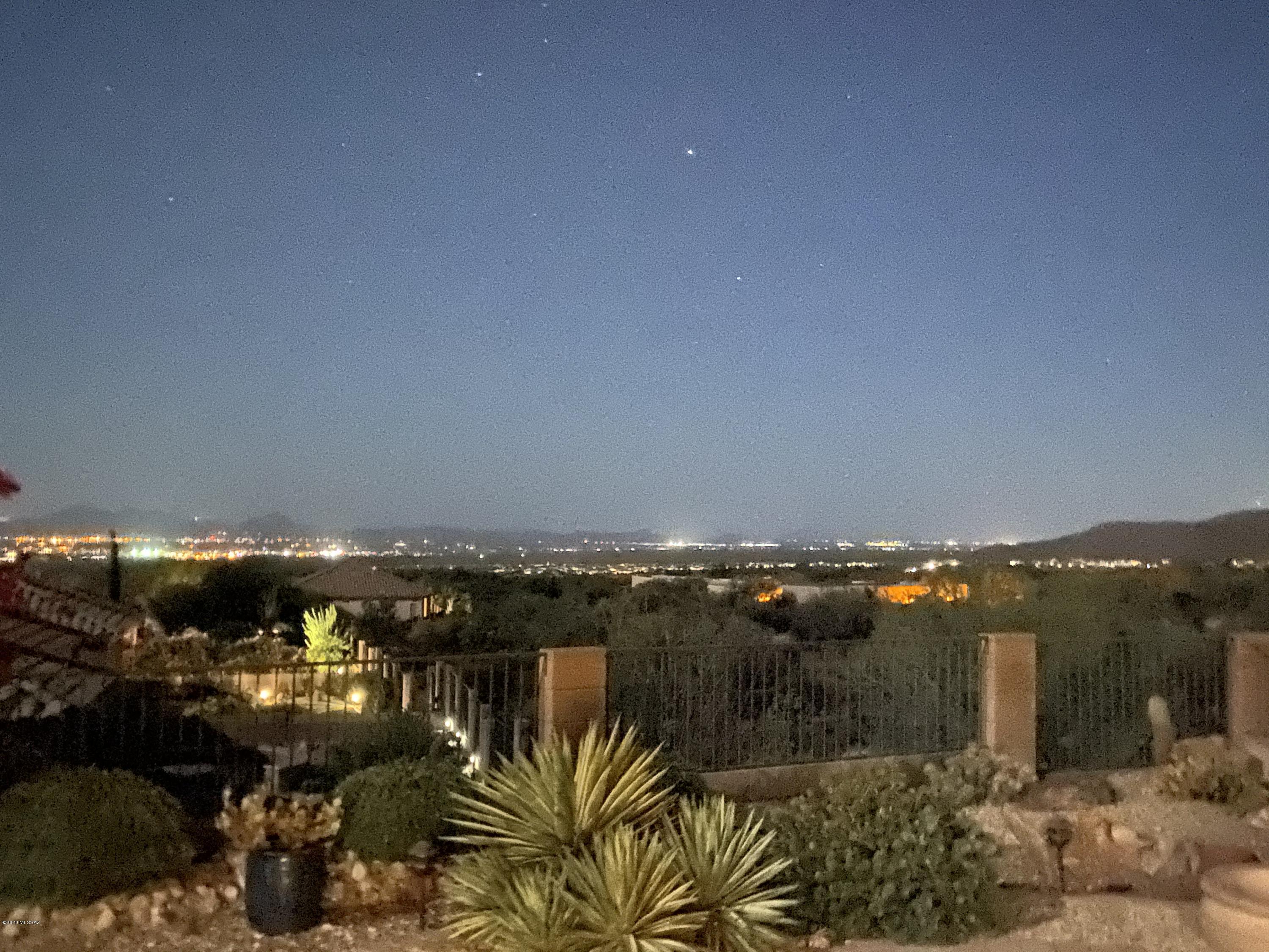 Panoramic views from this elevated lot!  Sweeping mountain views-Marana valley & city lights - mesmerizing sunsets. Quiet, peaceful cul-de-sac location. Gorgeous professionally designed rear yard. Gated front courtyard. This home has abundant improvements/upgrades which include: new HVAC system in 2019,  replaced carpet in great room w/vinyl plank wood-look flooring, added a Bosch dishwasher, epoxied garage floor & entry, toilets replaced w/Toto low-use units, painted exterior & fence @ 3 years ago, removed center post on rear porch for added views, installed entertainment system w/surround sound & patio speakers, changed all interior bulbs to LED, replaced driveway w/brick pavers. 3 bay windows & plantation shutters! Home is being sold fully furnished -turn key.Very nicely appointed home!