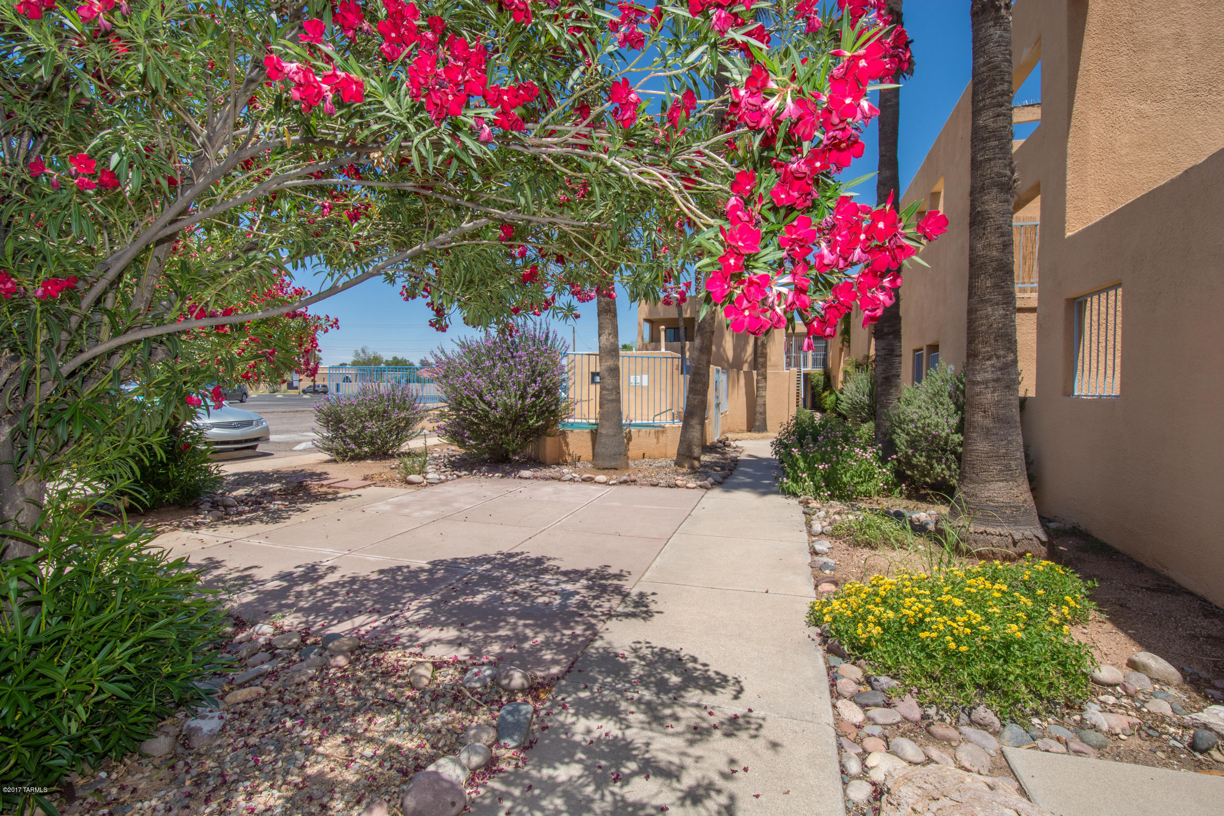 This is a totally cute and very well maintained home! It has neutral colors and uplifting decor. Enjoy Catalina Mountain views from the tiled balcony which has access from both bedrooms. This unit has its own washer and dryer inside the unit which stay. AC is less than five years old. Enjoy this well priced centrally located home.