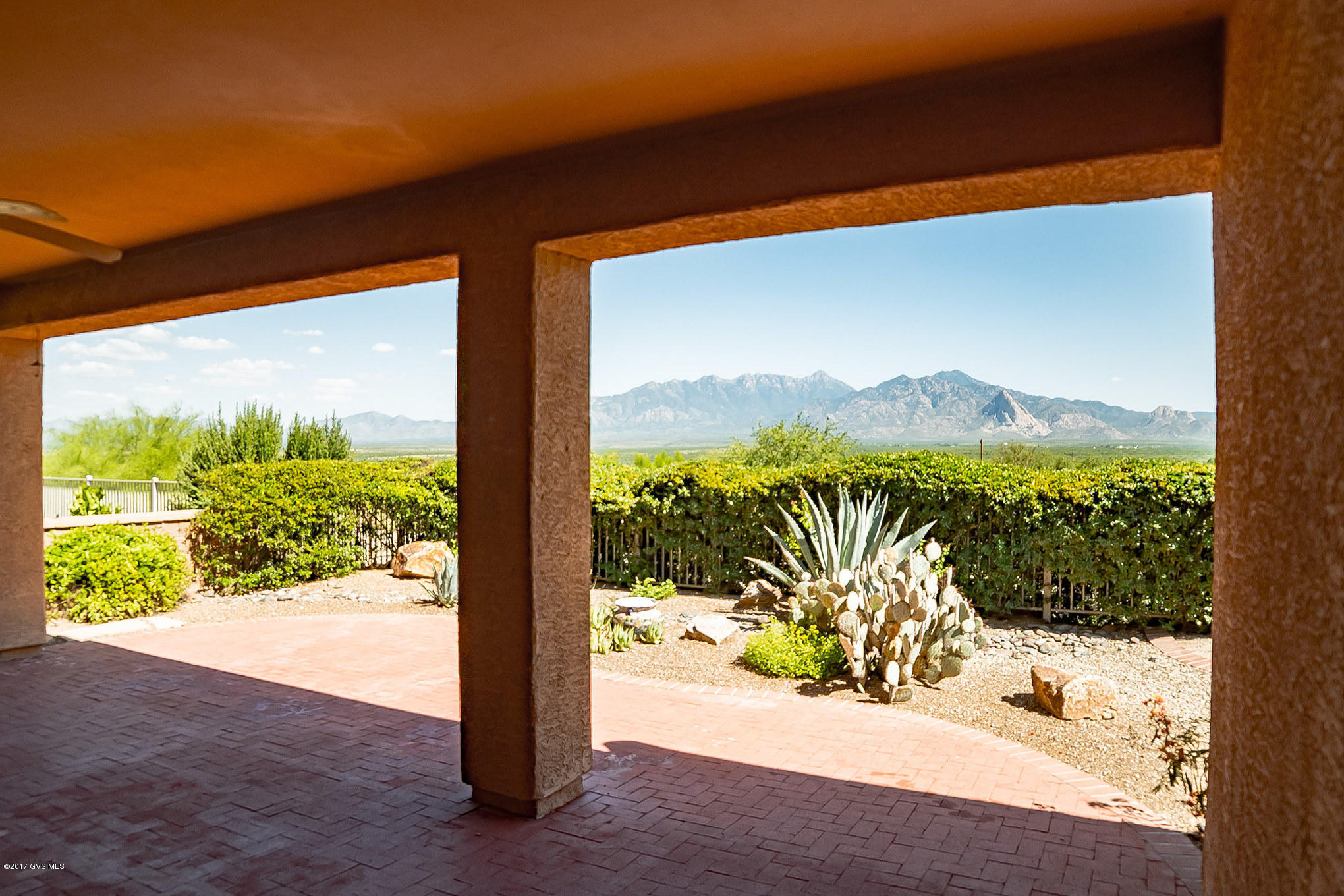If views are important to you, this one belongs at the TOP of your list! This Bonita w/ Casita offers front row seats to the ever-changing Santa Ritas. Enter the home through the beautifully tiled courtyard and one step inside, you'll be mesmerized by the panoramic mountain views. You'll love the great room floor plan and its many upgrades, including natural cherry cabinets, Corian Counters, executive height counters and so much more. The Casita offers your guests the ultimate in privacy with its one bedroom and bathroom. Step in back and prepared to be WOW'd by the mountain views stretching from the South to the North.