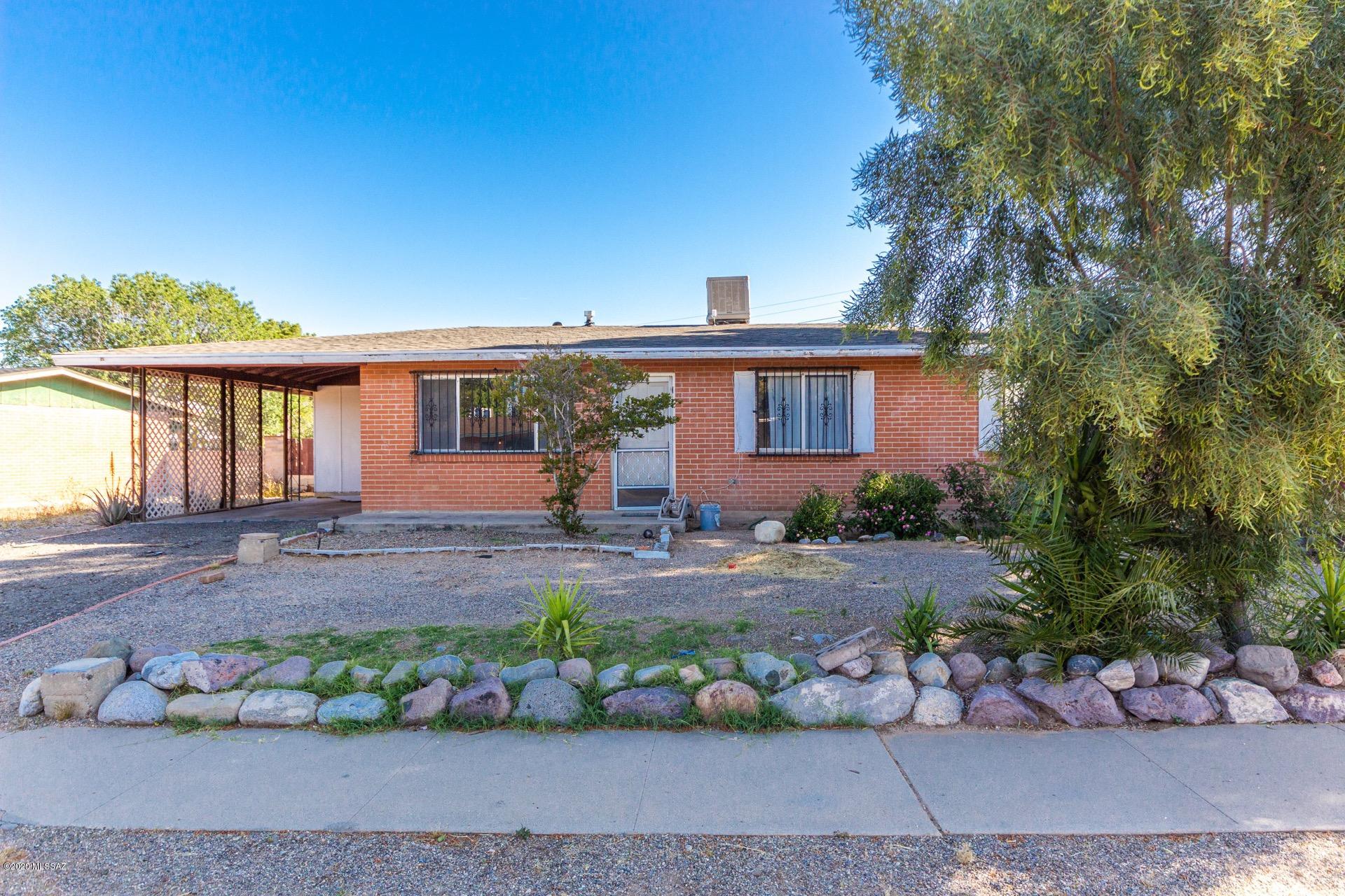 Very charming mid century ranch style home available in east Tucson. 3 bedrooms, 2 bathrooms plus a den with low maintenance tile flooring throughout. Perfect for gathering friends and family, the spacious eat in kitchen features tile counter-tops, a pantry and a breakfast bar. Master retreat includes a 3/4 en-suite. Huge backyard offers a covered and partially enclosed patio, plenty of room for pets and gardening, beautiful mountain views and is primed and ready for you to create the outdoor oasis of your dreams. All just a stones throw form shopping and restaurants and within minutes of downtown. This gem is available at an excellent value and will sell fast. See it today.