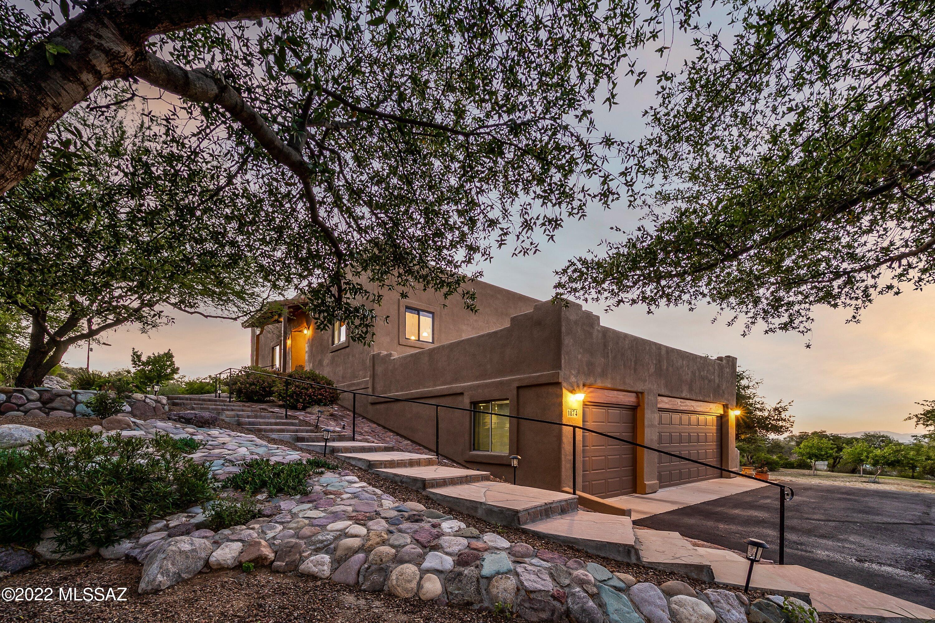 ABSOLUTELY breathtaking panoramic views from this immaculate custom home situated on 1 acre in the heart of Oracle! Enjoy rural living at its finest in this 3,000 sf home with living space on 2 levels including an oversized 3-car garage with storage/workshop area. Outside you will find a meticulously landscaped entryway as well as a walled backyard area with paths throughout the property to enjoy the surrounding nature. Thoughtful floorplan with  2 large bedrooms, full bath, office, family room and laundry on the lower level. Upstairs is the large master with updated bath, dual closets and balcony access. Cook's kitchen with all appliances, bamboo flooring, zoned AC, new Pella windows, entry door AND MORE make this move-in beauty a MUST SEE in person to appreciate all it has to offer!