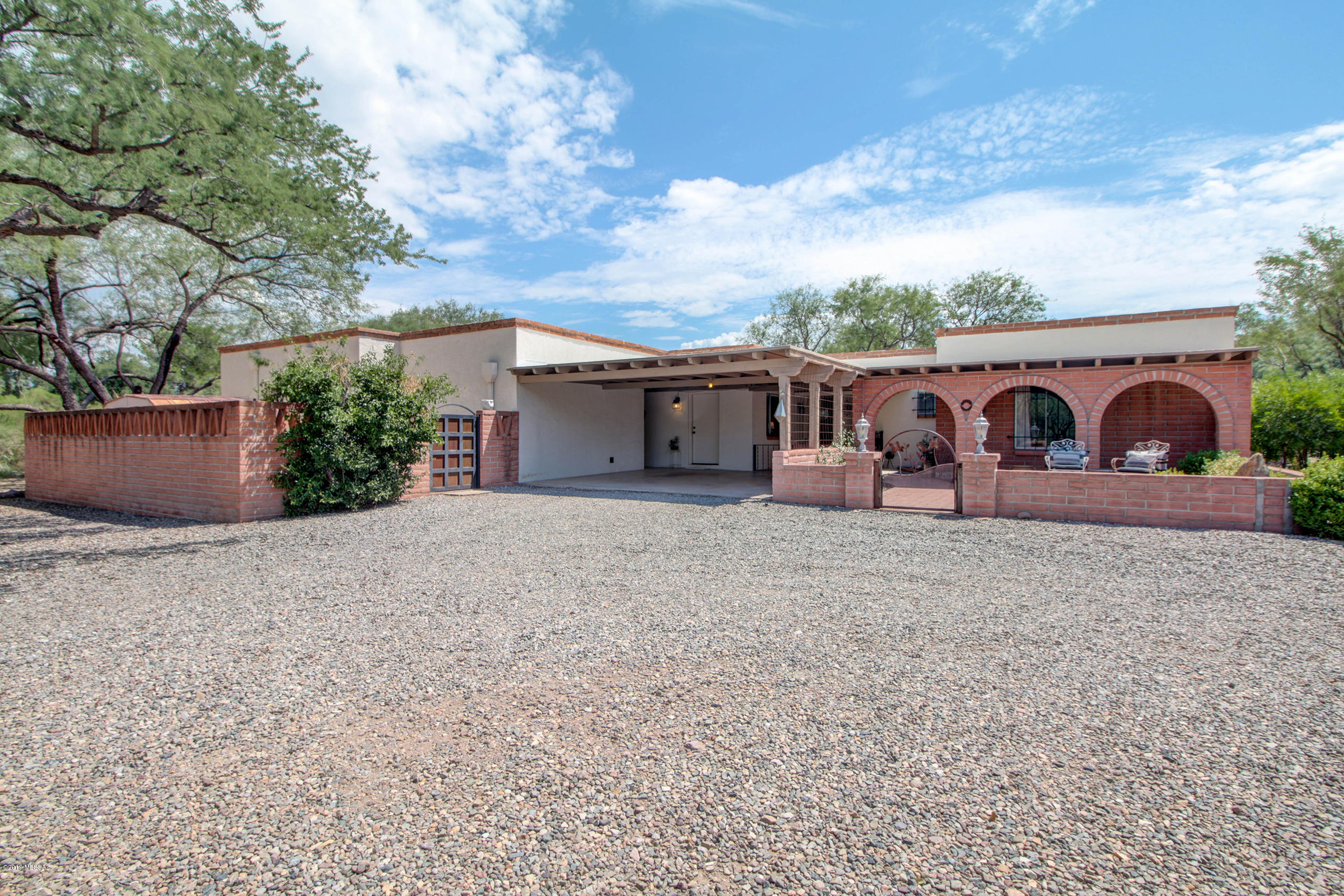 This beautifully-appointed 3 bedroom, 3 bath home is nestled in the desirable Tubac Valley Vistas subdivision, affording calm and peaceful environs.  This 2,709 square-foot home, recently remodeled, is tasteful, calm, spacious, and inviting.  Special attractions include a formal dining room, infused with natural light; a gleaming kitchen with farmer's sink; a gorgeous, vaulted enclosed garden room; and a covered patio overlooking a lovely pool and jacuzzi.  The well-manicured backyard is exceptionally relaxing for enjoying Tubac sunsets.  In addition, you can curl up next to the cozy living room fireplace on those chilly autumn mornings for coffee or a relaxing beverage at the end of a long day. This spacious home is ready for the next owner to move right in!