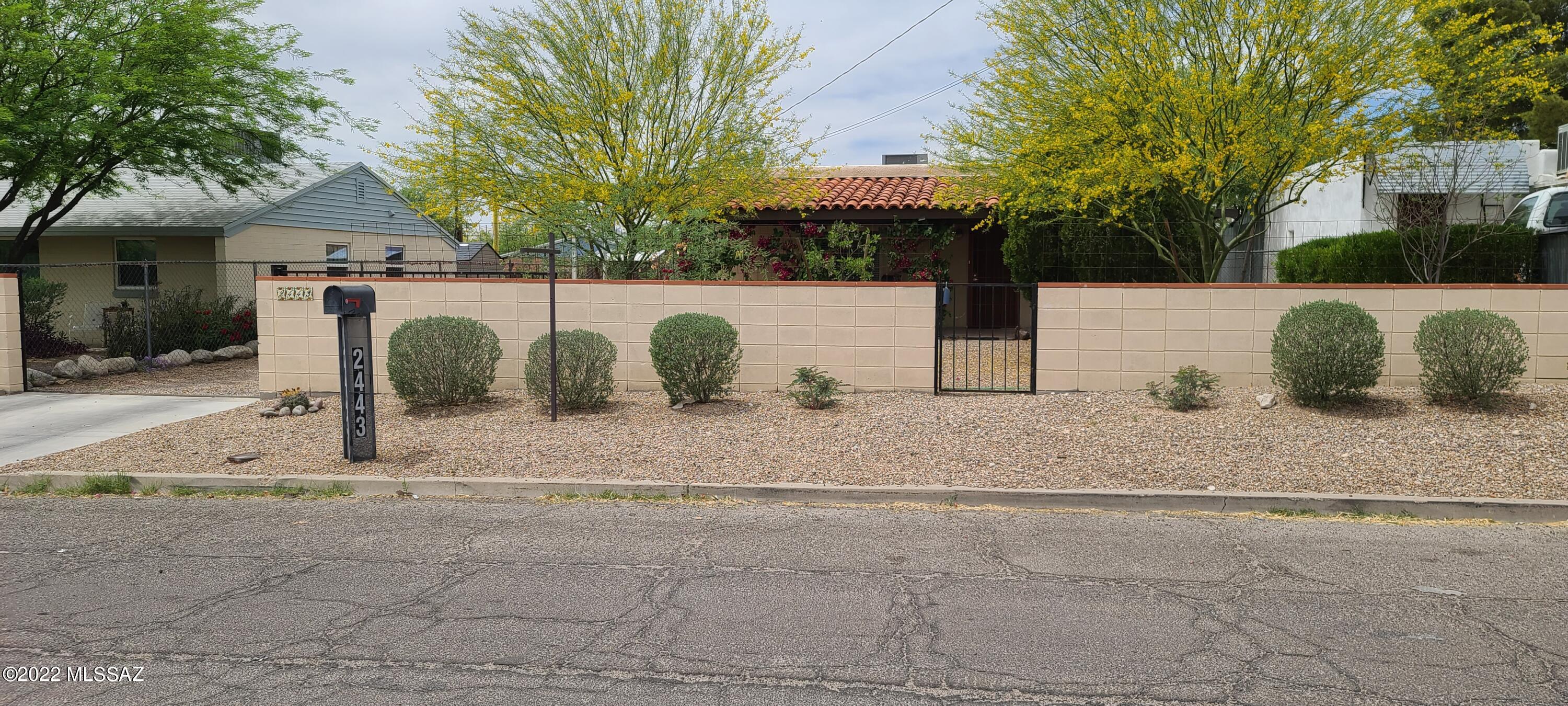 Centrally located charming bungalow, with a bright and open feel. This home is move in ready. Remodeled kitchen with new butcher block countertops, remodeled spacious bathroom. New light fixtures, new interior doors, freshly painted interior, 2 very large bedrooms, new water heater, new HVAC, lots of tile flooring & and a large fully fenced lot. Large front porch and court yard with mountain views. Fresh gravel and beautiful native plantings in front yard.  Attached over height carport with 30 amp plug in. Huge rear yard with mature mesquite trees, plus a double gate to bring in all your toys. Side yard with covered patio off  living room slider for entertaining or just sit and relax. Storage shed, composting bin and more... See list of improvements under document tab.