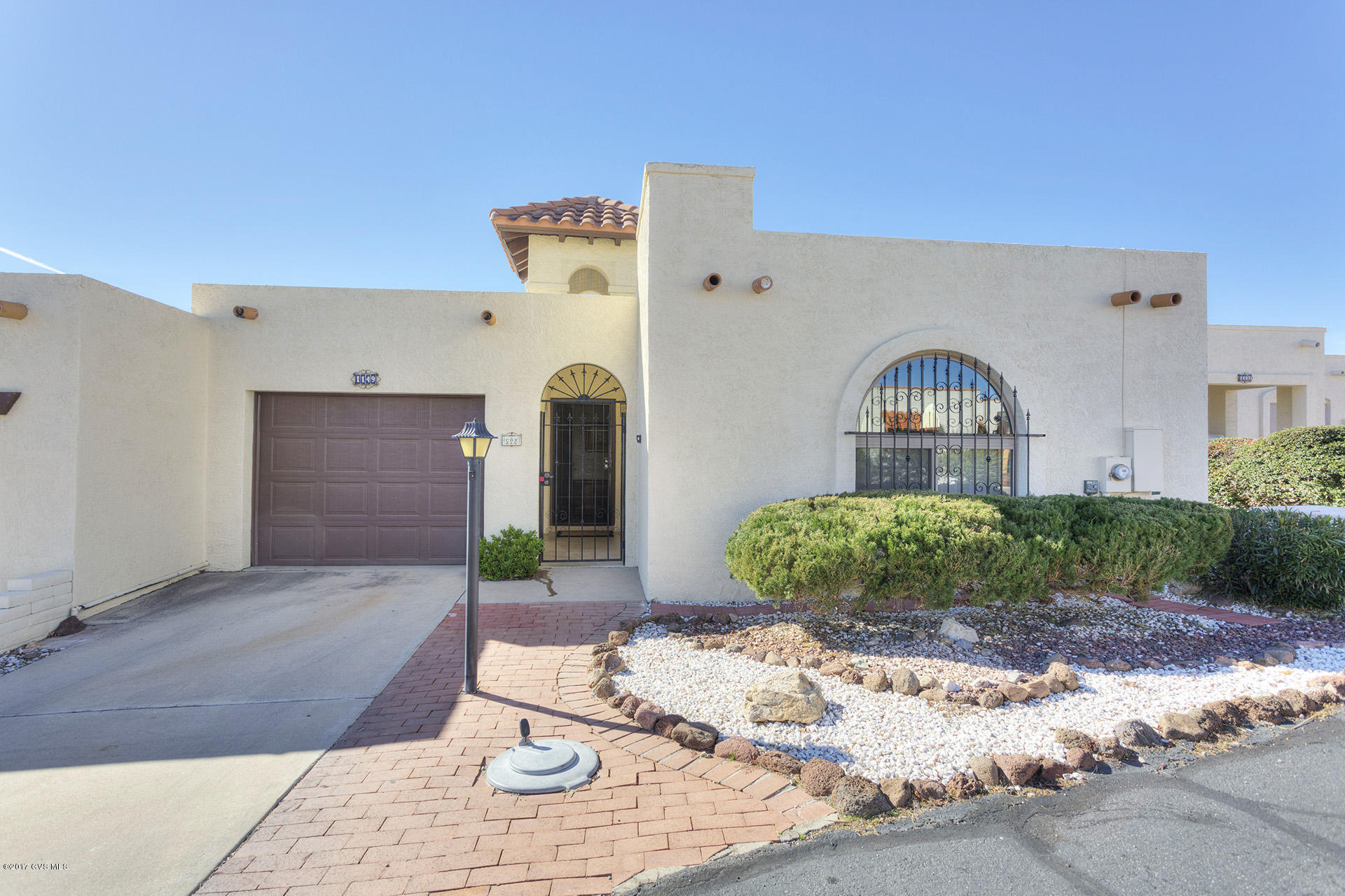 COME AND SEE FOR YOURSELF; THIS BEAUTIFUL 2 BEDROOM, 2 BATH, HOME BOASTING CAPTIVATING VIEWS IN DESERT HILLS 2. GREAT COVERED TILE PATIO W/VIEWS TO ENJOY EVENING OR MORNING & LOW MAINTENANCE YARD W/BLOOMING ROSES ON DRIP. IMPECCABLE HOME W/COZY BRICK FIREPLACE IN THE GREAT ROOM, UPGRADED LIGHT FIXTURES & FANS. TILE IN KITCHEN, BATHROOMS & HALLWAY. NEWER WINDOWS INSTALLED 2015 TO KEEP THE HOME AT YOUR PERFECT TEMPERATURE, NEW HEAT PUMP, FRESH PAINT ON EXTERIOR, LOOKS SO NICE, RECENT ROOF COAT & EPOXY IN THE CARPORT. APPLIANCES INCLUDED. WATER TEC SYSTEM INSTALLED. THIS HOME IS MAINTAINED & YOU WILL ENJOY THE CONVENIENCE OF NEARBY POOL AND REC CENTER. *A MUST SEE*