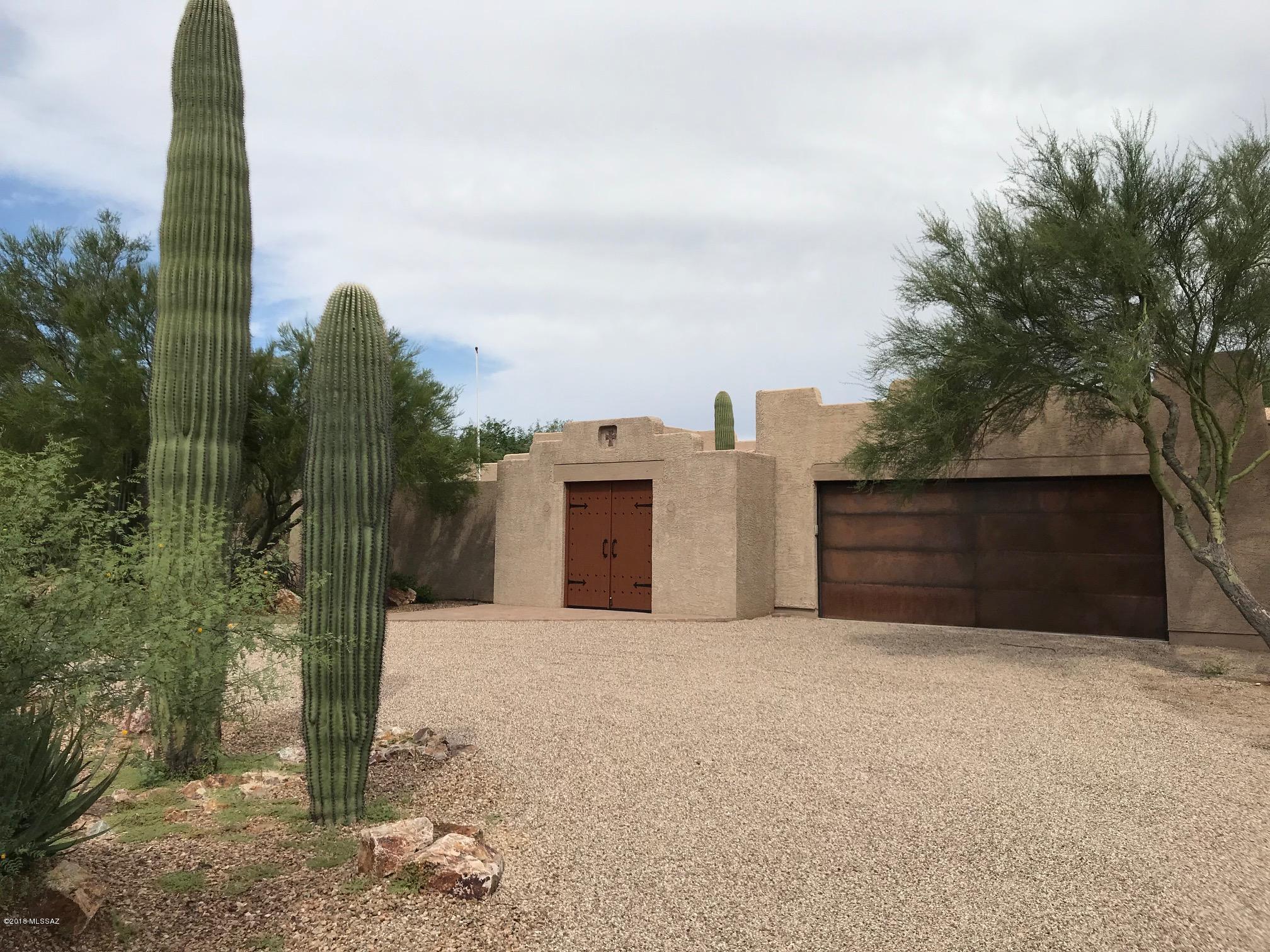 Very private lovely home in great condition on over 1/2 acre with many upgrades. Perfect for entertaining w/  Oversized pool & grotto waterfall, in-floor cleaning system, auto-chlorination. Backyard BBQ area has outdoor sink, plus built-in chimenea & bench seating. All windows are Low-E (exc door sidelight)& most include rolling shutters (east & west sides plus Lr window). Private patios at entry & off both the LR & Mr bath plus full-length covered rear patio. Poly plumbing has been replaced. Luxury Mr bath includes Jacuzzi tub and separate shower with dual showerheads & controls & a large customized walk-in closet. All tile flooring except Mr Br. Playhouse has water and electric. Plenty of yards for additional expansion. Safe DOES NOT STAY. Alarm included but not activated.