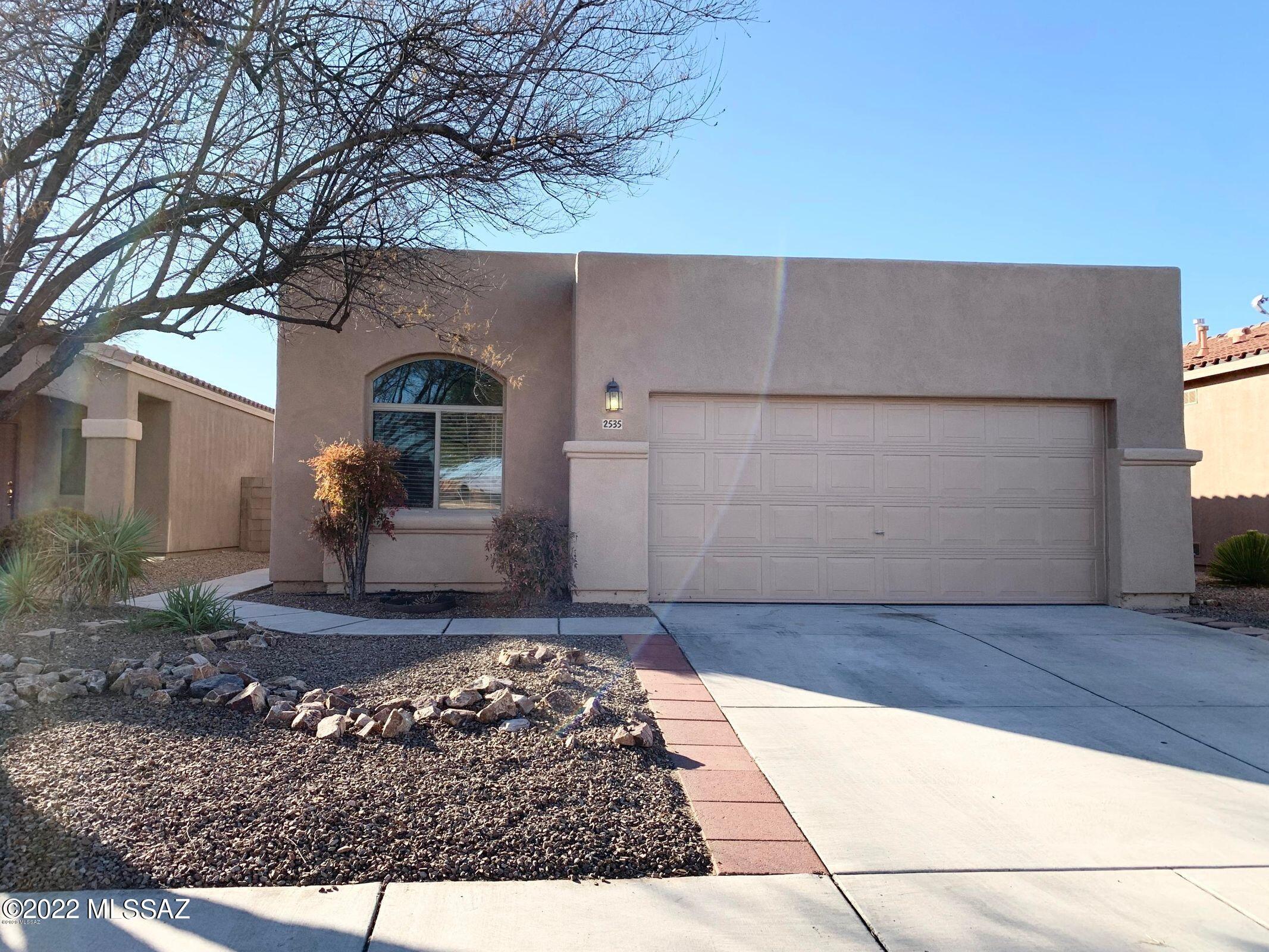Beautiful 3 bedroom/2 bath home just minutes from I-19 and walking distance to local shopping center. Split floorplan, tile throughout trafficked areas, and desert landscaping with a peaceful sitting area in yard make this the perfect family home. Neighborhood features a community area, basketball court, and pool! More pics to come!