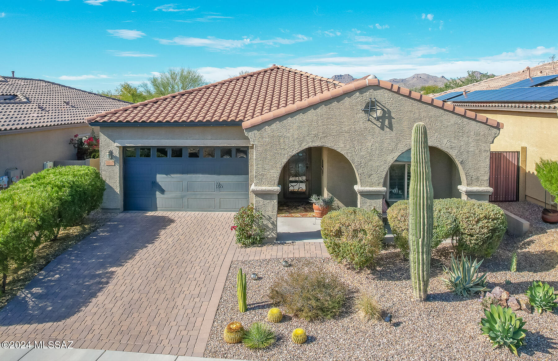 Gorgeous 3BR/2.5BA (1,836 sq ft) home in gated Desert Crest at Center Pointe Vistoso offers front Catalina views plus rear peeks of the Tortolitas. Property backs to the Vistoso Trails Nature Preserve for ultimate privacy. Newer ledge fireplace, front security door and bedroom carpet, plus interior house/garage paint and plantation shutters throughout (2020). Great room showcases ceramic plank tile and 16' center-pull sliding glass door with new sliding screen doors. Upgraded kitchen hosts island with breakfast bar, granite countertops and stainless appliances. Private Owner's Suite affords a luxury bath with dual sink vanity, glass framed walk-in shower plus walk-in closet. Other amenities include bench window seats in guest rooms, laundry & powder rooms, 3-car tandem garage, plus 10-foot ceilings and 8-foot doors throughout. Enjoy the rear covered patio, built-in BBQ, synthetic lawn, sandbox plus block & view fencing. Center Pointe offers a park, playground, clubhouse, pool/spa, splashpad and firepit ramada.