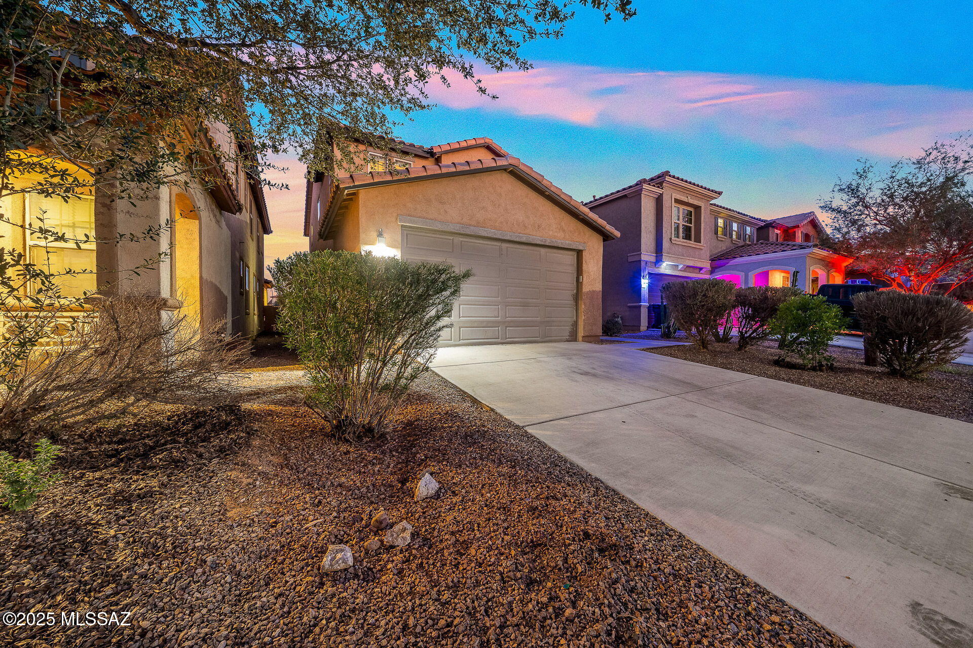 Welcome to this beautifully upgraded home in the heart of the Presidios at Rancho Sahuarita! Enjoy soaring 10' ceilings downstairs and 9' upstairs, plantation shutters, quartz countertops, stylish backsplashes, and rich tile flooring. The chef's kitchen includes a farmhouse apron sink, cabinet-mounted microwave, sleek range hood, and gas range. Upgrades include pet-resistant carpet with premium padding, Tyvek wall insulation, extended baseboards, exterior gas BBQ hookup, and a water softener. Full bath upgrade downstairs. The primary bath features a spa-like deep soaking tub with rock wall to melt away daily stress. Quarterly pest service, biannual HVAC, and termite warranty add peace of mind. This home is a must see!