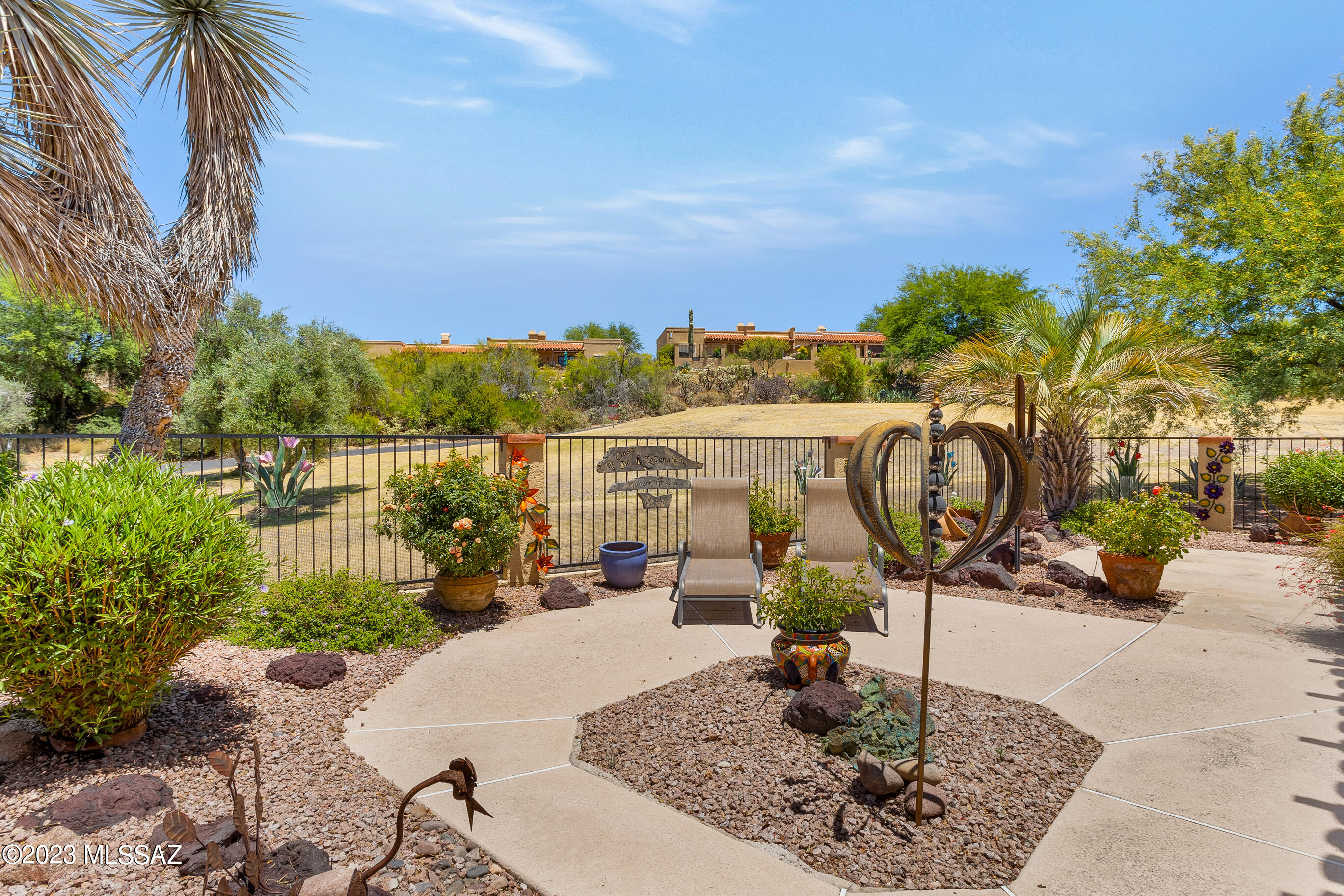 Vibrant & bright 2 bedroom 2 bath describes this patio home in the most desirable neighborhood of the El Conquistador Patio homes. Situated on a fantastic lot overlooking the green of the 3rd Hole .
Large open space flanks the side of the home for the feeling of being in a very open setting. The generous backyard is beautifully landscaped to add to the enjoyment of the natural surroundings.
The home has been meticulously maintained & 
 there are areas with numerous updates over the years. 
The kitchen has stylish rough edge granite, a new dishwasher, double ovens. 100% of the home is tile flooring 
The dining room is accented by a most unique light light fixture and gorgeous saguaro ribbed sliding door covers.The rest of the home has wide plank shutters which allow for excellent view The home has 4 sliders to exit home to accommodate patio seating.  The secondary bedroom has a built in Murphy bed with twin beds and a built in desk unit. Beds go up & down with ease . In addition the bathrooms each have skylights to allow natural light!
Step out the side yard gate to appreciate the golf course or a short walk to the Hilton El Conquistador Resort. Take advantage of the resort amenities with optional membership offered by Hilton. Seasonal memberships for the Pusch Ridge golf course are also available. The Patio homes are conveniently located to shopping , medical and all that the Town of Oro Valley offers.