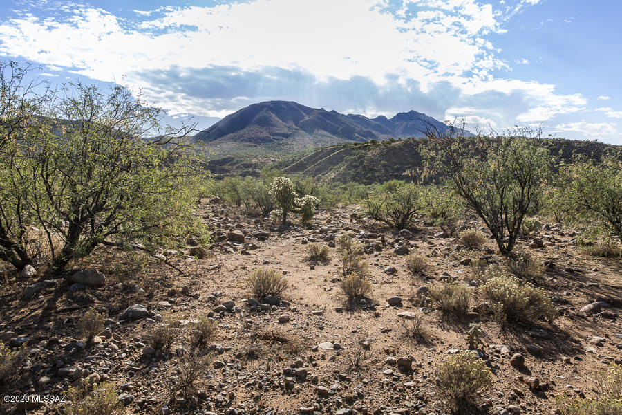 Build you custom home on this view lot in Northeast Rio Rico, just a few miles from the freeway, I-19. Enjoy Southern Arizona sunrise and sunset views from your back porch. Electricity and phone lines along the lot lines. Connect to community water along the lot line also.