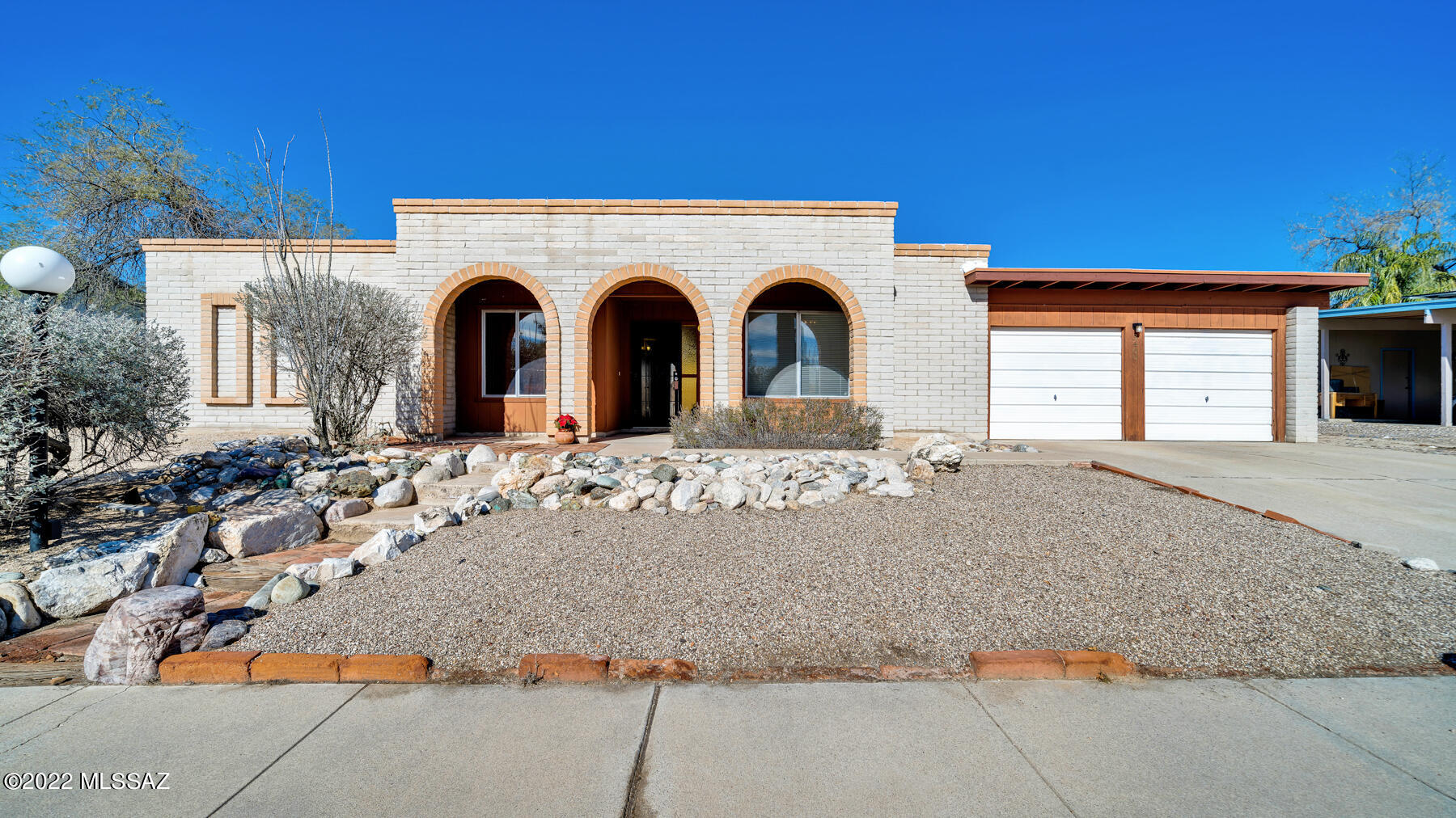 This classic southwest ranch style home features 4 bedrooms, 2 bathrooms, a 2-car garage with workshop and a beautiful custom built, beehive fireplace in the spacious great room. Double gates provide easy access to the large backyard with hookups for your RV and a huge covered patio, plus no pesky HOA! Enjoy cool summers & warm winters with a newer Trane HVAC system and energy efficient dual pane windows! The tastefully updated kitchen features Corian countertops, custom lighting, and hickory cabinets. Skylights flood both bathrooms with natural light and two bedrooms boast walk-in closets. Located on a quiet cul-de-sac with easy access to the freeway, this charming home includes all appliances and is move-in ready. Schedule a showing today!
