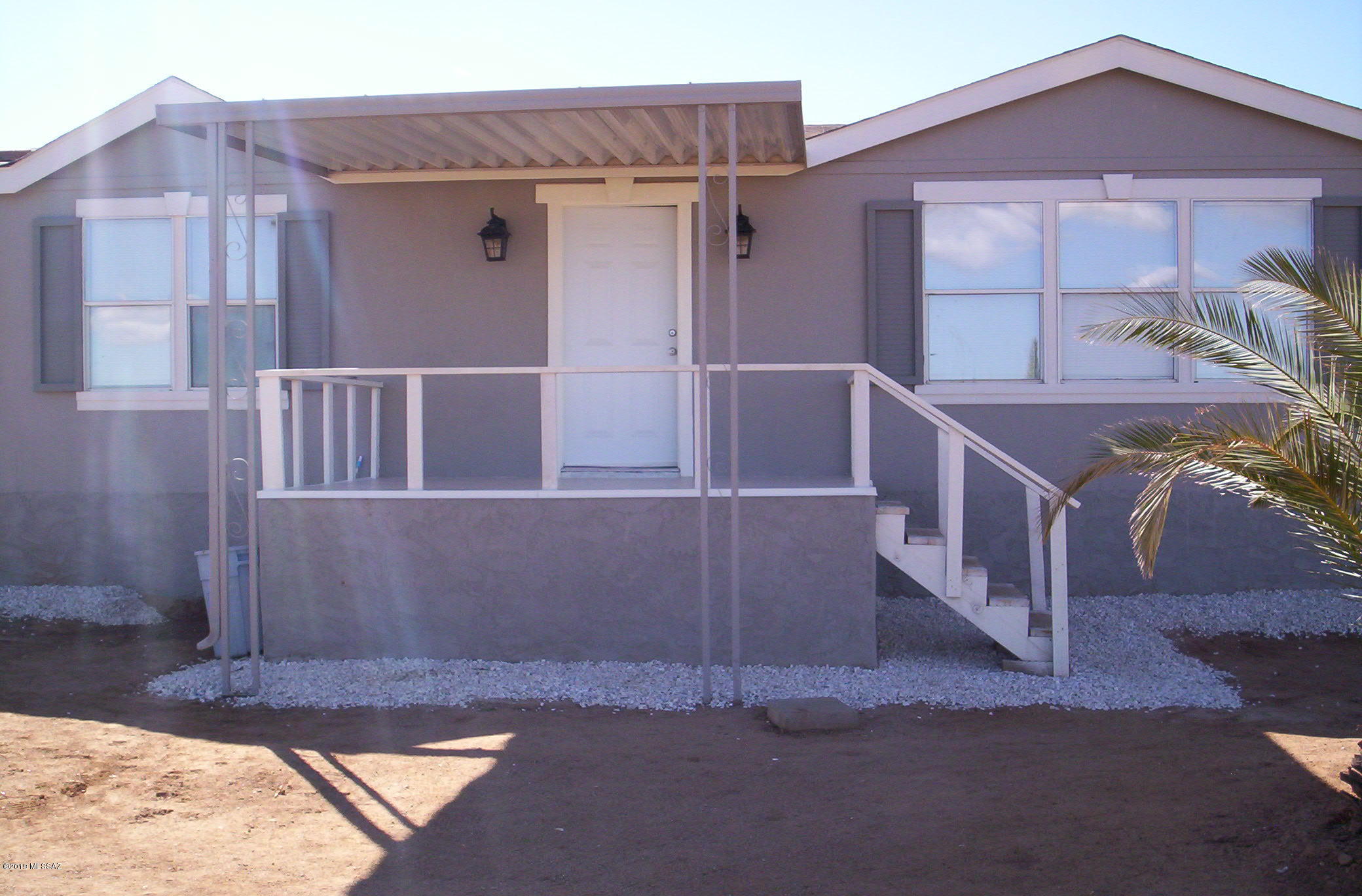 Excellent location. Home is close to new and customs homes, with 2.27 acres and MOUNTAIN VIEWS you can be sure that you will like it. The house has been updated to give you peace of mind and better living space. Front, and back entrance and steps are new, fresh paint with accent color and new stucco. New water pump and air pressure tank have been installed. Decorative rock around the house with palm trees. Drywall with new texture, fresh paint. New wood floor and carpet all 3 bedrooms. Kitchen and bathrooms cabinets have been painted and have Granite counter tops, large island, . New refrigerator, electric range, plus recessed lights, new baseboard. New plumbing has been installed. Energy saver dual pane windows. A/C heat pump. Toilets are water saver. Come and see it yourself yourself