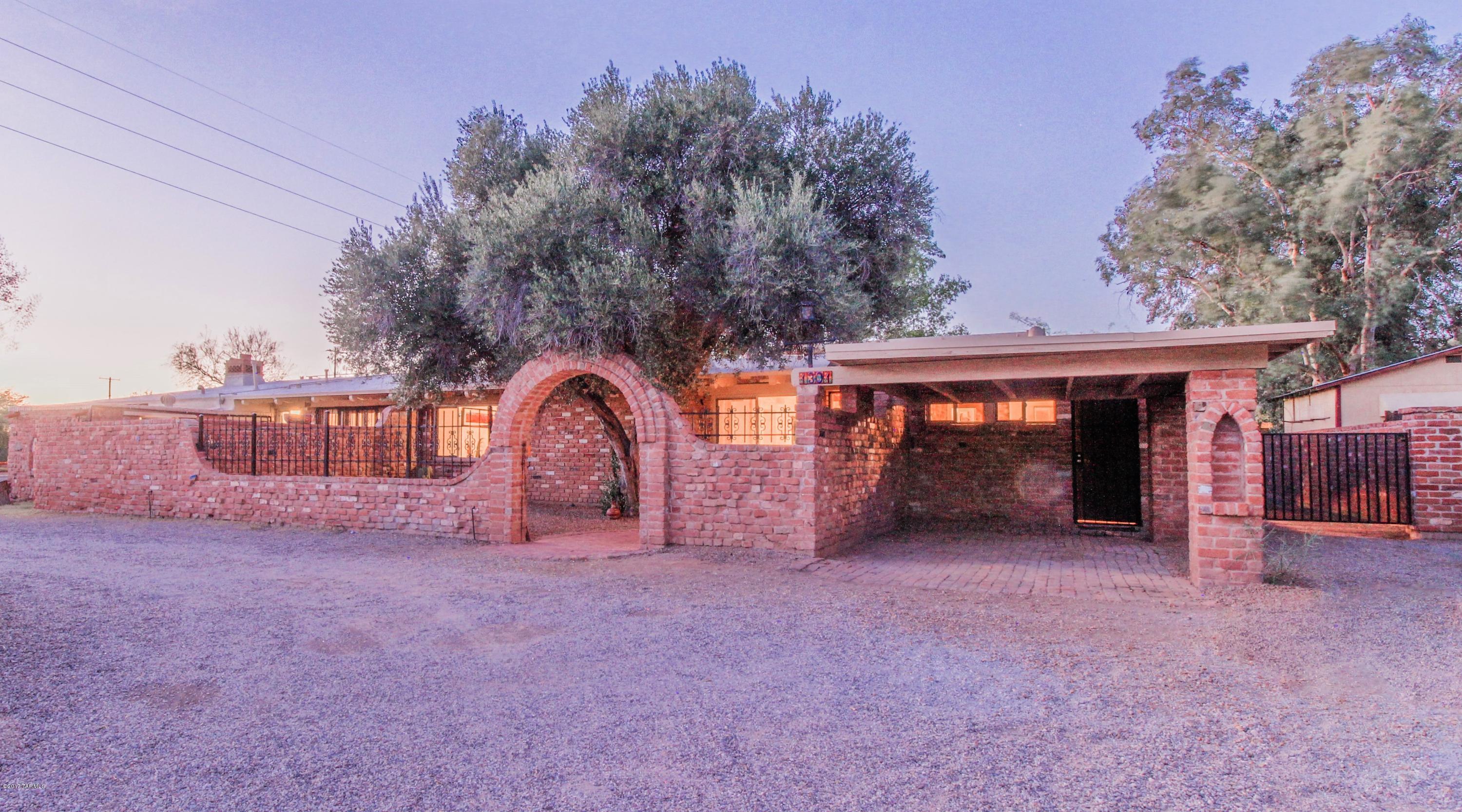 One of Tucson’s most exceptional properties.   There is so much charm & character is this home that is continues to amaze all those who see it.  Built in 1959 by Cactus Jack, it features unique brick offsets, colors & architecture, like the many beautiful fireplaces & unique backyards.  The home is split into 2 sides w/ a main side w/ 3 bedrooms & 1 bath & a guest suite side with 2 bedrooms & 1 bath.  Also features 2 private backyard patios & 2 courtyards.  The home was recently remodeled w/ gourmet kitchens featuring stainless steel appliances, stainless steel ventilation hoods above the gas countertop ranges.  The cabinetry features self closing drawers too.  The bathrooms are wonderfully remodeled w/ distinctive tile showers, glass shower doors & more.  See additional documents.
