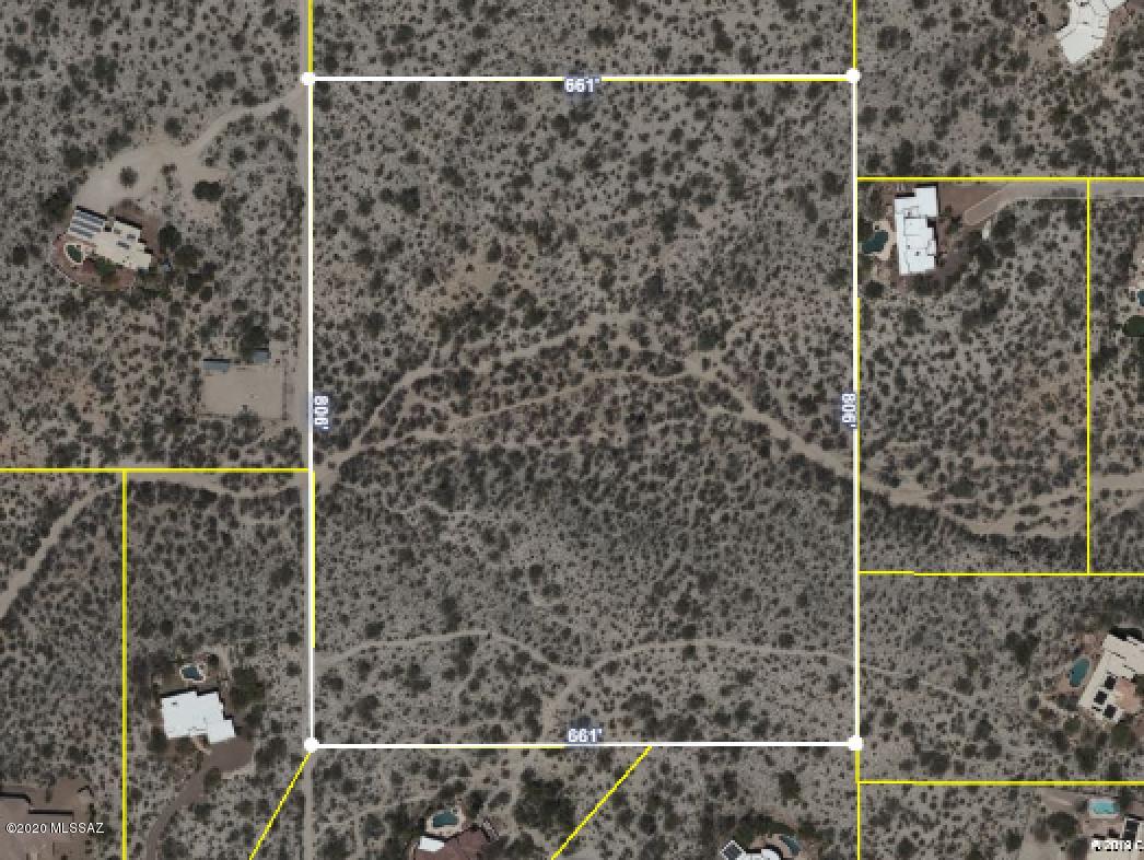 You will love the amazing city and mountain views from this gorgeous 11.71 acre  parcel.  Many beautiful, mature saguaros and lovely natural desert landscape.  Easy flat build site at the top of the bluff to the south, lends itself to great privacy and sweeping views.  A second build site possible atop another bluff with natural division between (see documents) should a lot split be desired.   Permanent access easement granted through gated community Rancho Cancion from original developer.  Paved road up to the easement road.  HOA dues are for road maintenance only and parcel is not subject to the HOA CCR's or bylaws.   Parcel can also be accessed via Perlita Road.  This rare find large parcel is zoned  for horses with plenty of room for accessory buildings, barn and equestrian facilities.