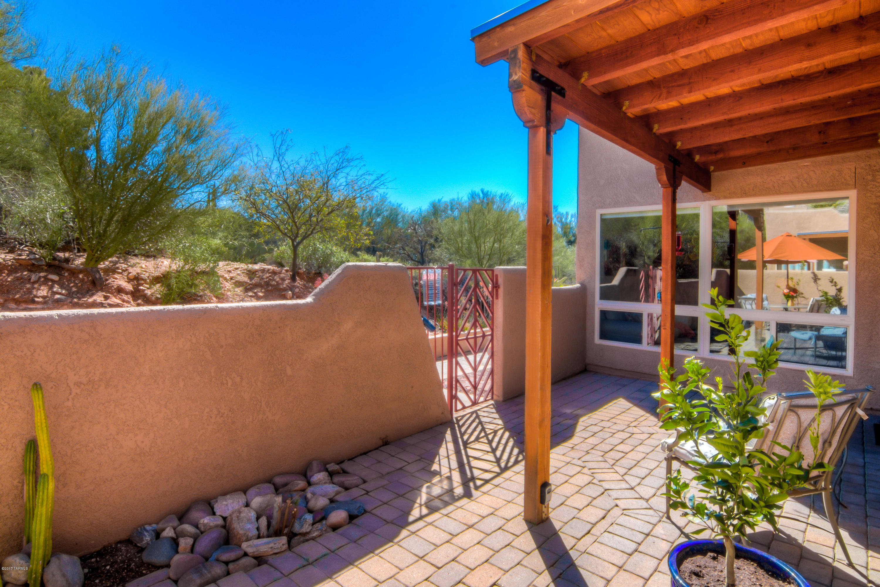 Beautiful location in the Catalina Foothills! One of the most cherished communities next to DeGrazia Galleria of the Sun! This single story “townhouse style” condo w/secluded private courtyard + covered patio has majestic mountain views. Contemporary interior, kitchen w/brkfst bar,cherrywood cabinets,granite countertops. Living room w/fireplace and big dual-pane windows to enjoy amazing mountain views from your sofa. Bruce Park Avenue laminate floor upgrade. Recessed lighting,skylights,ceiling fans. 2BR/2BA, 2 walk-in closets. Separate laundry room w dryer/washer. All appliances included. Covered parking spot. Exceptional amenities: Community pool,spa,BBQ area w/fabulous mountain views, gym,clubhouse. HOA covers exterior painting,roof,termite. Seller will accept offers between 175K-195