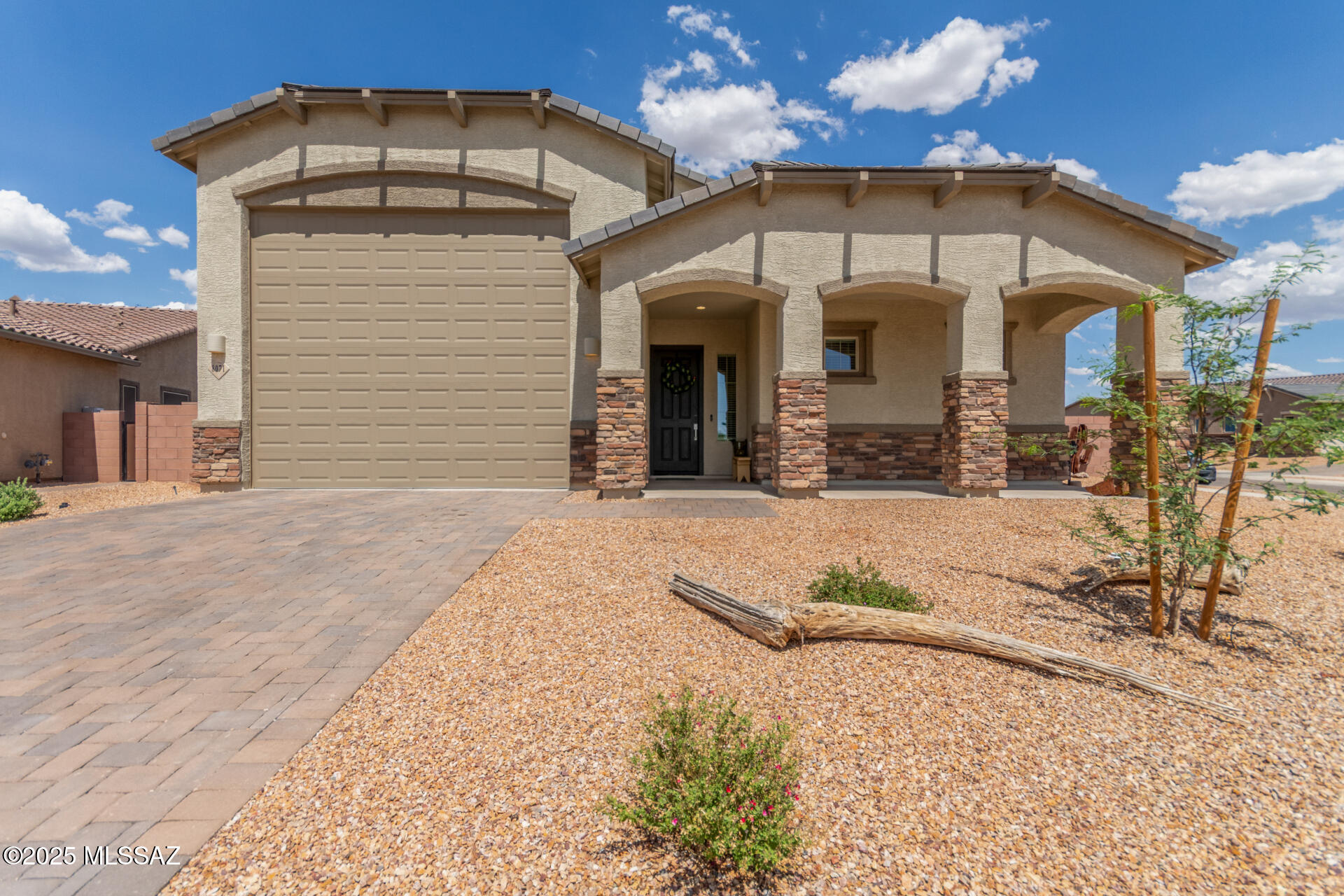 Range priced from $499,000 to $520,000.Wake up every day to sunrise views over the Rincon Mountains and end your evenings in a backyard built for relaxation. This beautifully upgraded 3-bedroom, 2-bath home blends modern comfort with rare features you won't find anywhere else.

Inside, the open layout shines with quartz countertops, sleek cabinetry, and natural light that makes every space feel inviting. The 4-bay tandem garage is a true standout — perfect for cars, outdoor toys, tools, or a home workshop.

Located in the highly rated Vail School District, this move-in-ready home offers both everyday convenience and a lifestyle worth celebrating. Whether it's sipping coffee with the sunrise or unwinding in the evening glow of the desert, Bentgrass Lane is the perfect backdrop.