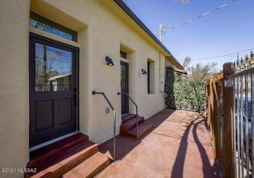 Stunning remodel of turn of the century homes, property held in one family since 1873. Owner remodeled to the level of ''99% new.'' These are two homes, on two separate parcel codes, being sold together. Use as a  home and a guesthouse, home office in the smaller house, use as a family compound, or live in one, Airbnb the other. ALL NEW but for the exterior walls; the value in these homes is simply incalcuable! Tankless water heater, 36'' Thor gas range, all wood windows and doors, gas fireplace insert, wood-look tile, simply gorgeous new home and GH in the heart of one of Tucson's oldest neighborhoods, historic Armory Park. Offstreet parking in front of all new wrought iron fencing in front of the smaller home.  Private back and side yards await your creative touches.