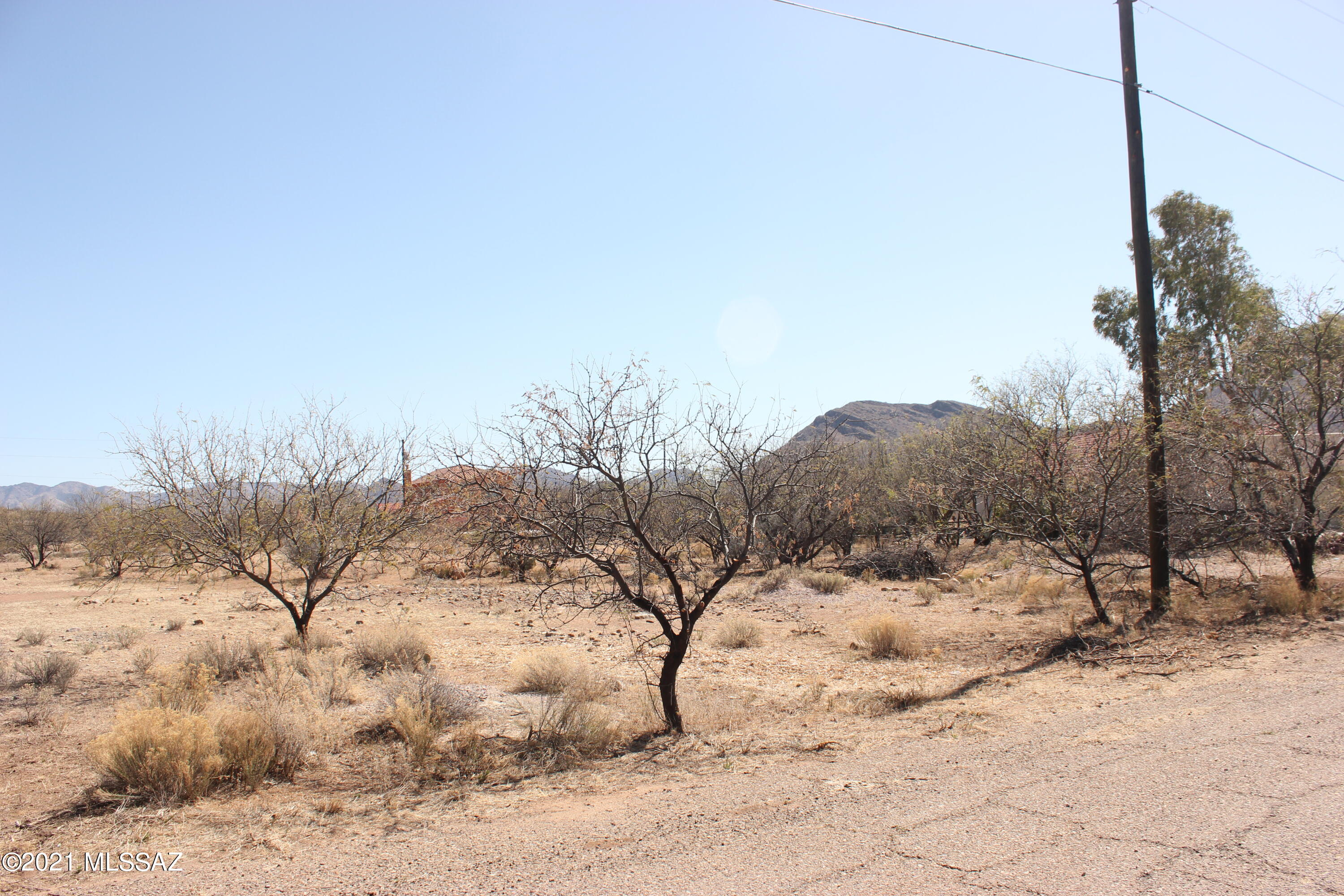 Flat residential lot, all paved roads.  Electric water and sewer available in this Subdivision of Villas 12.  Good views.