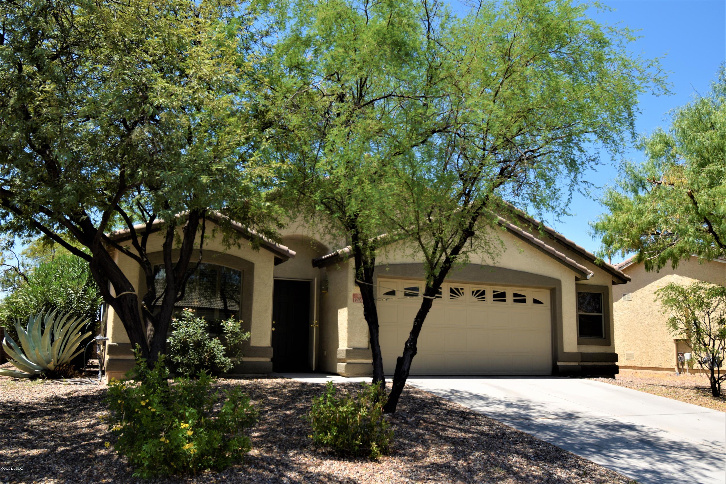 With 4 bed, 2 bath, and a 2 1/2 car oversized garage, this nearly 1900 sf home is ready for it's new owner. Vaulted ceilings throughout, welcome you into the well appointed kitchen with updated GE Slate appliances, corian counters and a large island. A NEW HVAC system was installed 8/17/20 and features a 10 year warranty. Nothing to worry about and more efficient than original models. Situated in Gladden Farms, the community offers miles of running trails, a fantastic splash pad, and is less than a mile away from the Marana Community pool at Ora Mae Harn park. Gladden Farms Elementary is specific to the neighborhood and a beautiful new school. With a true split floor plan, formal dining area and more, this home is a great example of why this plan is so popular! Agent related to sellers.
